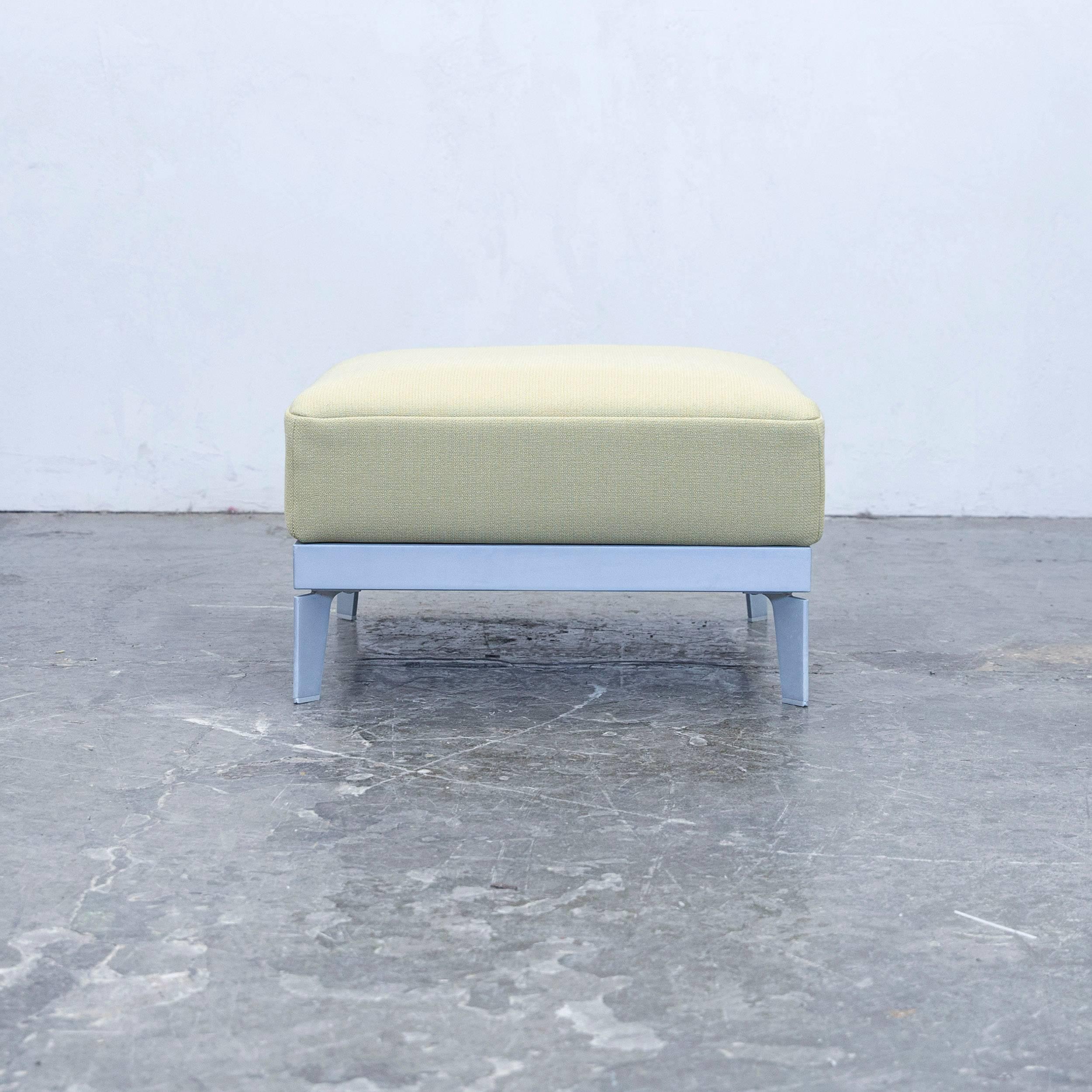Green colored original Rolf Benz Plura designer footstool, in a minimalistic and modern design, made for pure comfort.