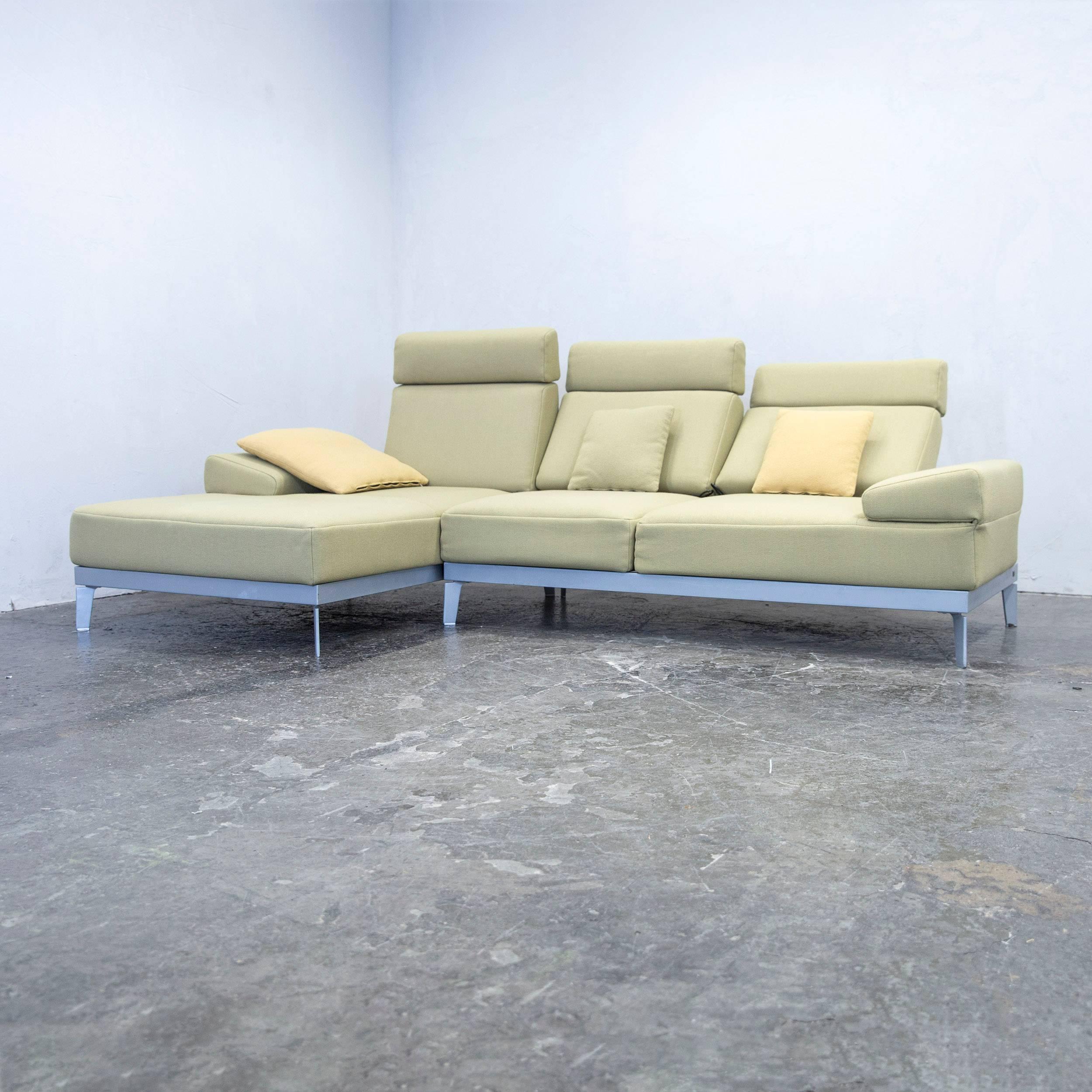 Green colored original Rolf Benz Plura designer corner sofa and footstool, in a minimalistic and modern design, with convenient functions, made for pure comfort and flexibility.