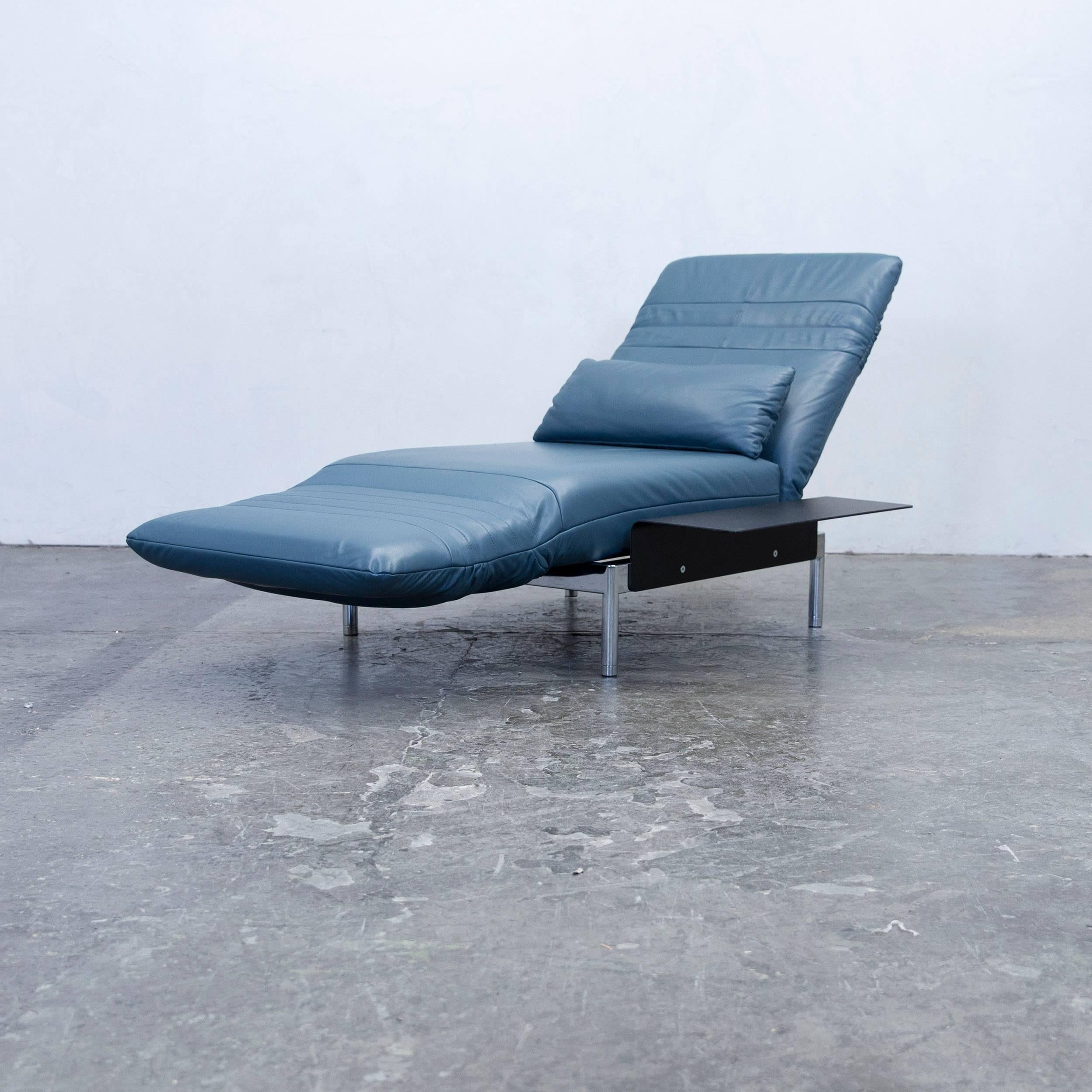 Blue colored original Rolf Benz Plura designer leather chair, in a minimalistic and modern design, with convenient functions, made for pure comfort and flexibility.