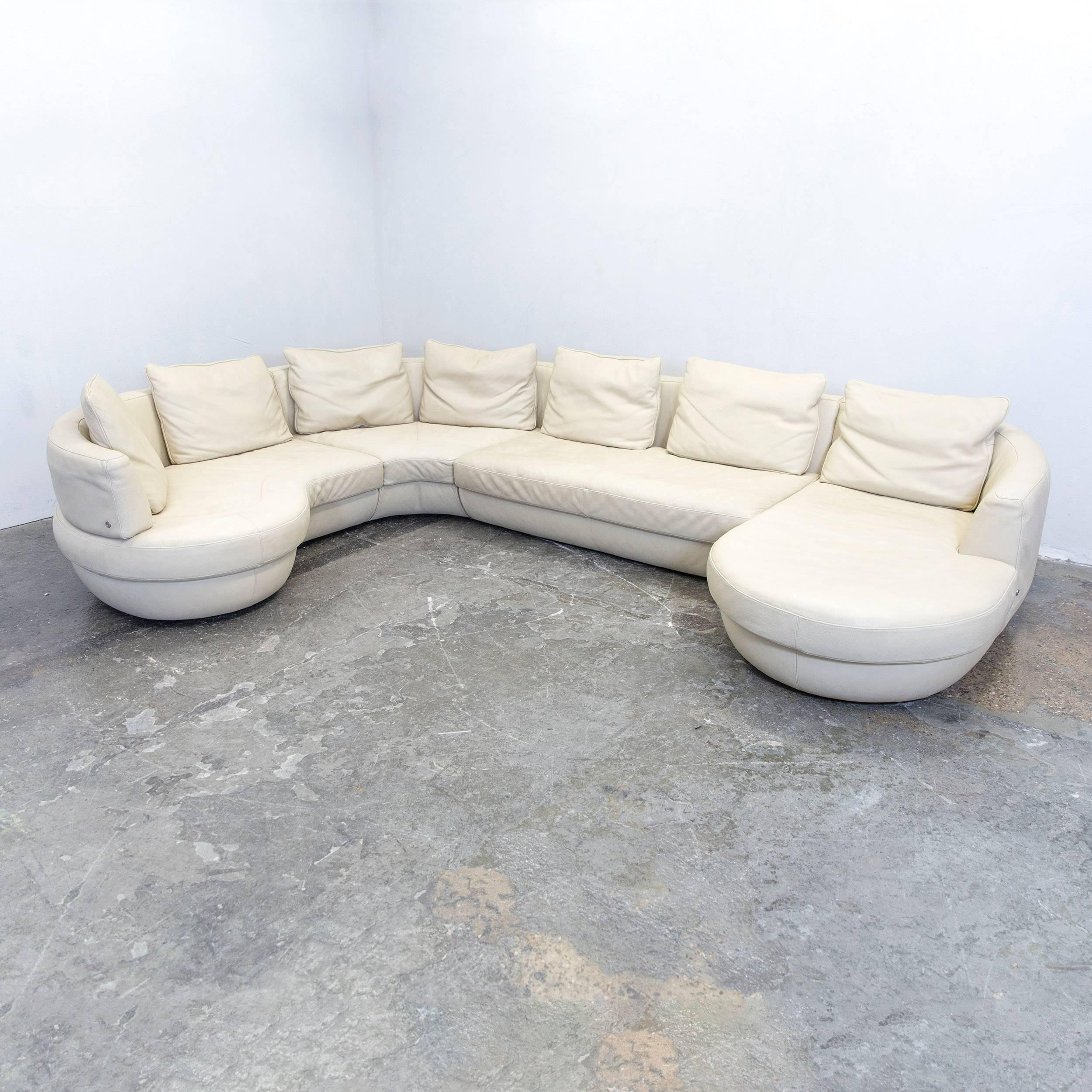 Beige colored original Natuzzi designer corner sofa, in a minimalistic and modern design, with convenient functions, made for pure comfort.