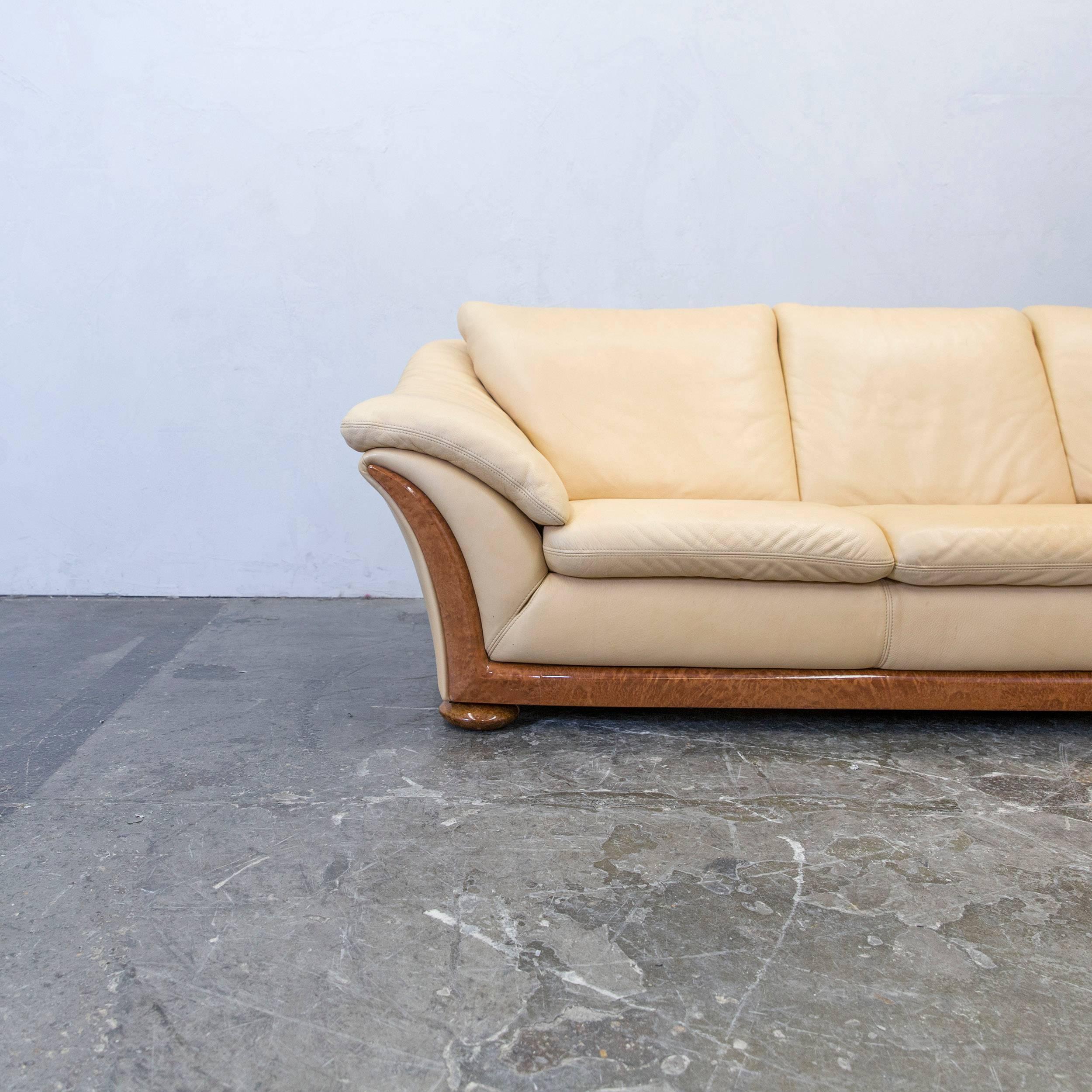 Beige colored designer corner sofa, in a minimalistic and vintage design, made for pure comfort.
