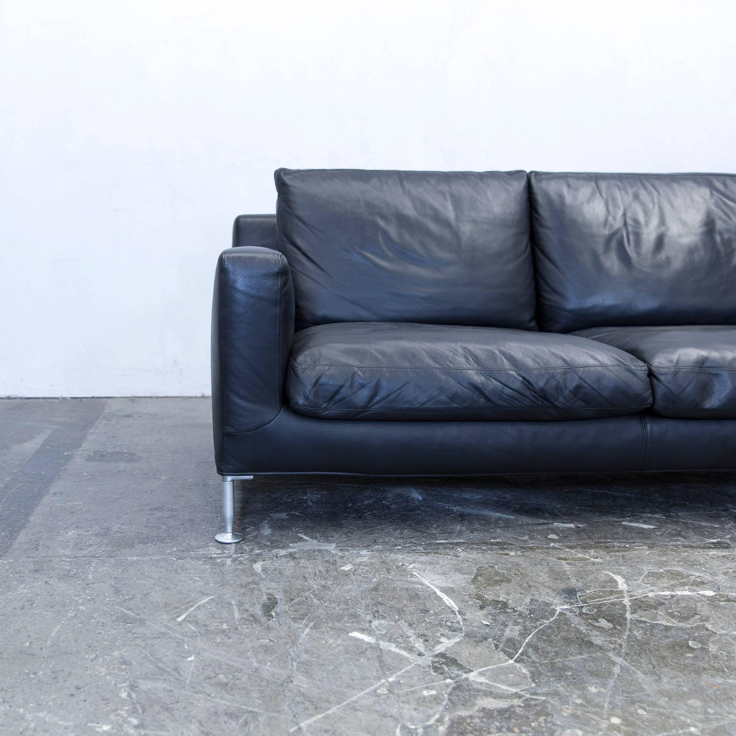 Black colored original B&B Italia Harry designer leather sofa, in a minimalistic and modern design, made for pure comfort and style.