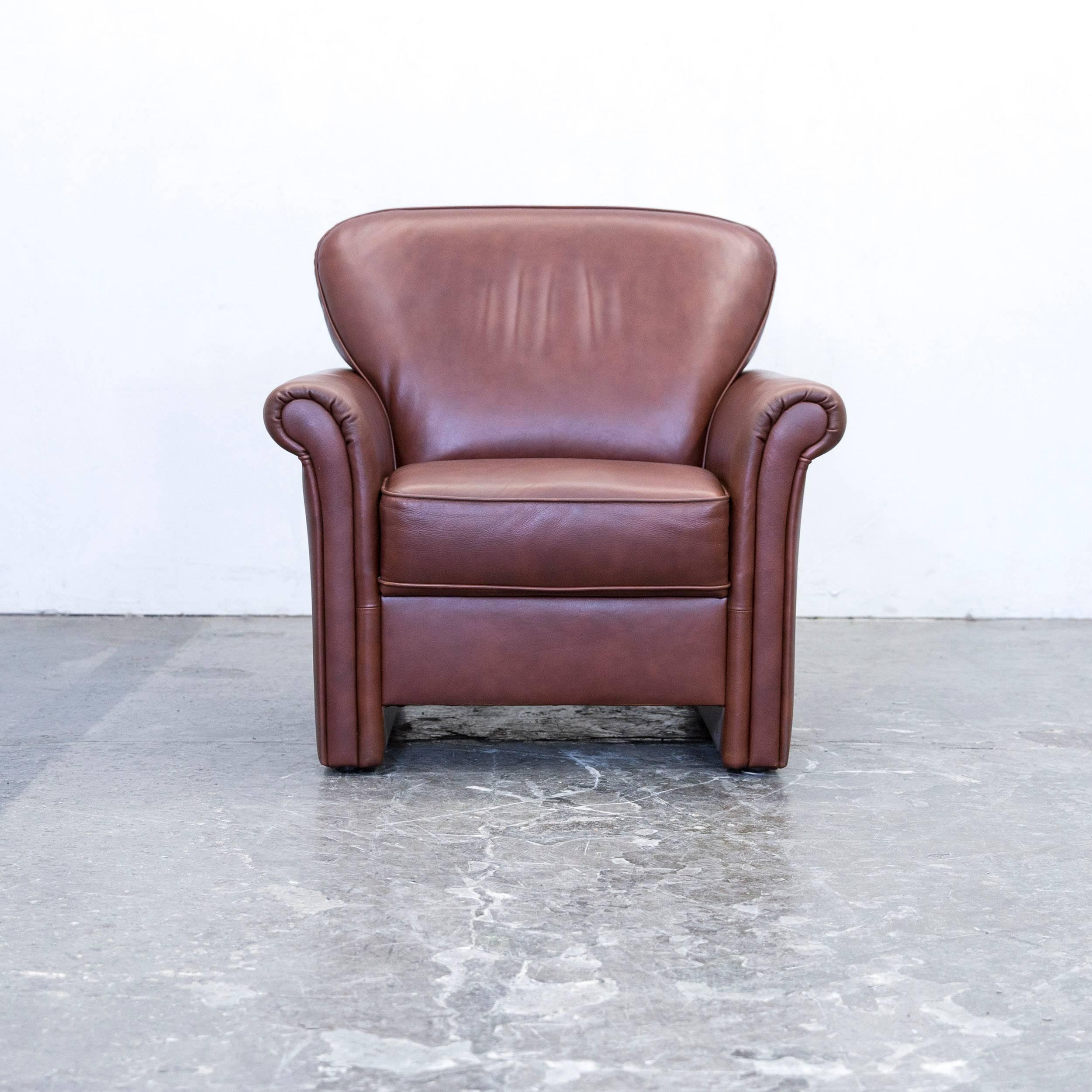 Brown colored original Gepade Akad`or designer leather armchair, in a minimalistic and modern design, made for pure comfort.