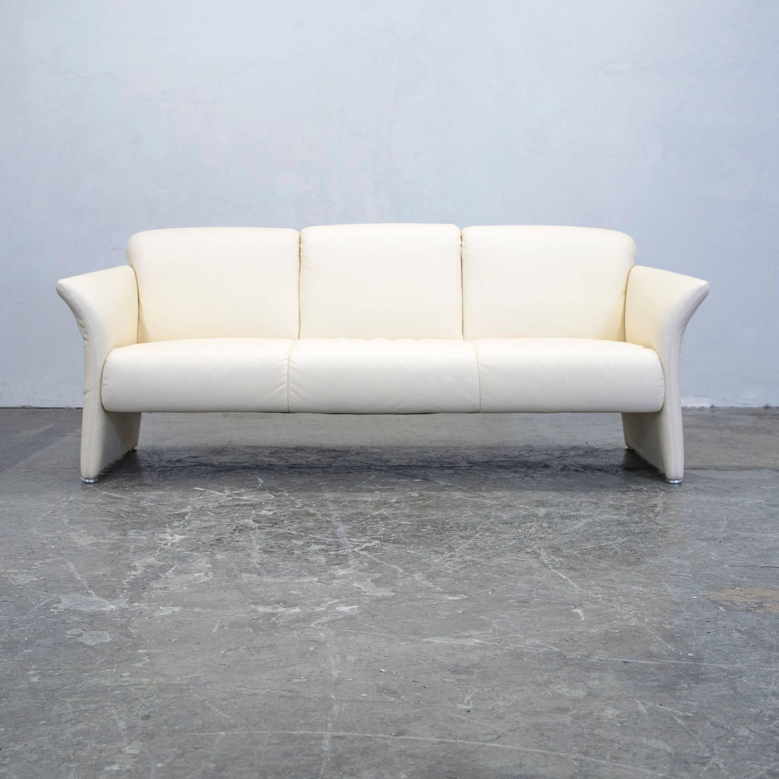 Crème colored designer leather sofa and armchairs, in a minimalistic and modern design, made for pure comfort.