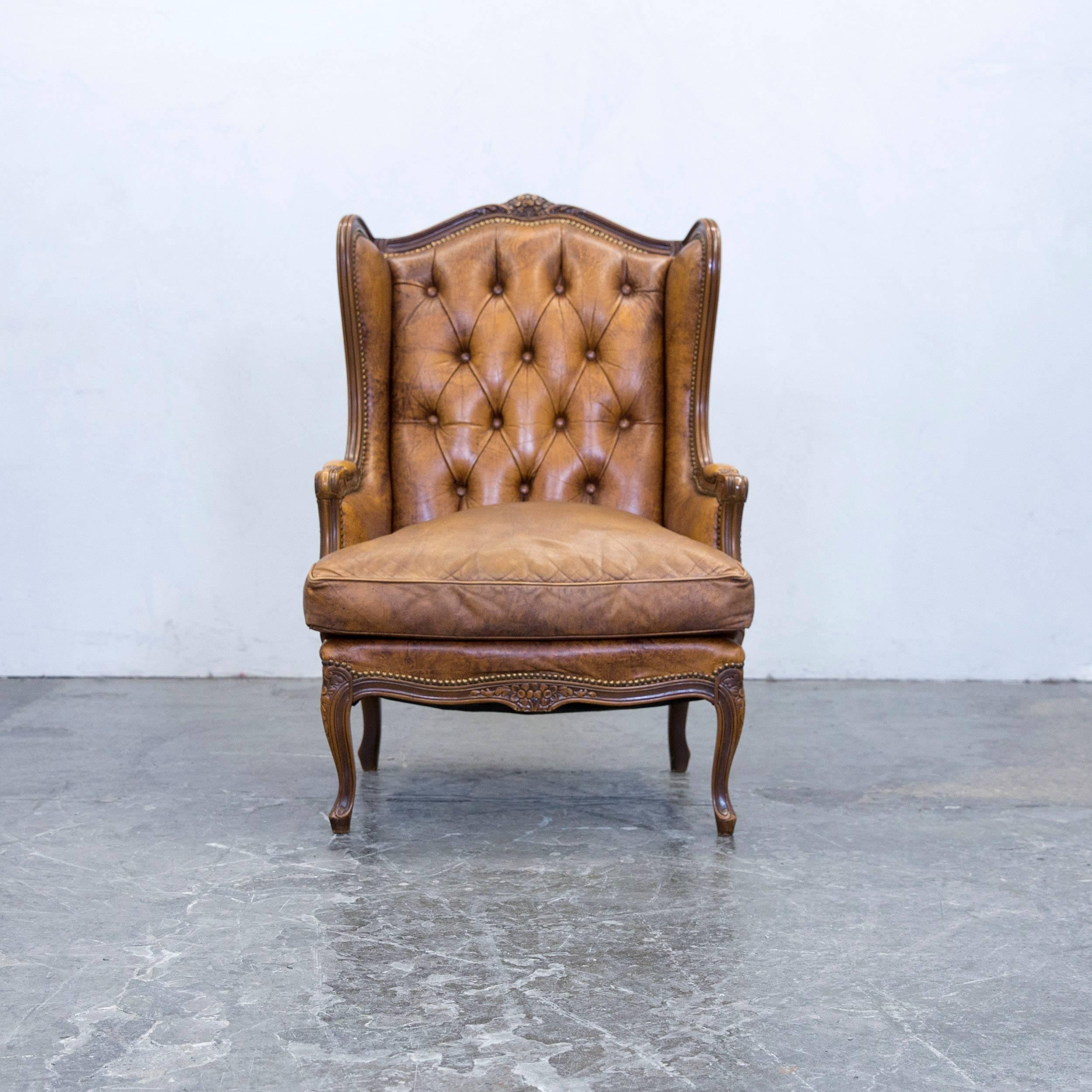 Cognac brown colored Chesterfield leather armchair, in a vintage and elegant design, made for pure comfort and style.