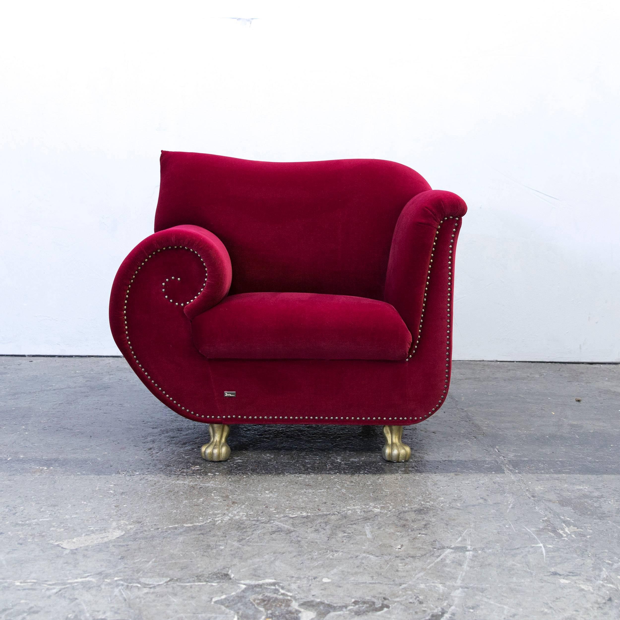 Red colored original Bretz Gaudi designer armchair, in an elegant design, made for pure comfort and style.