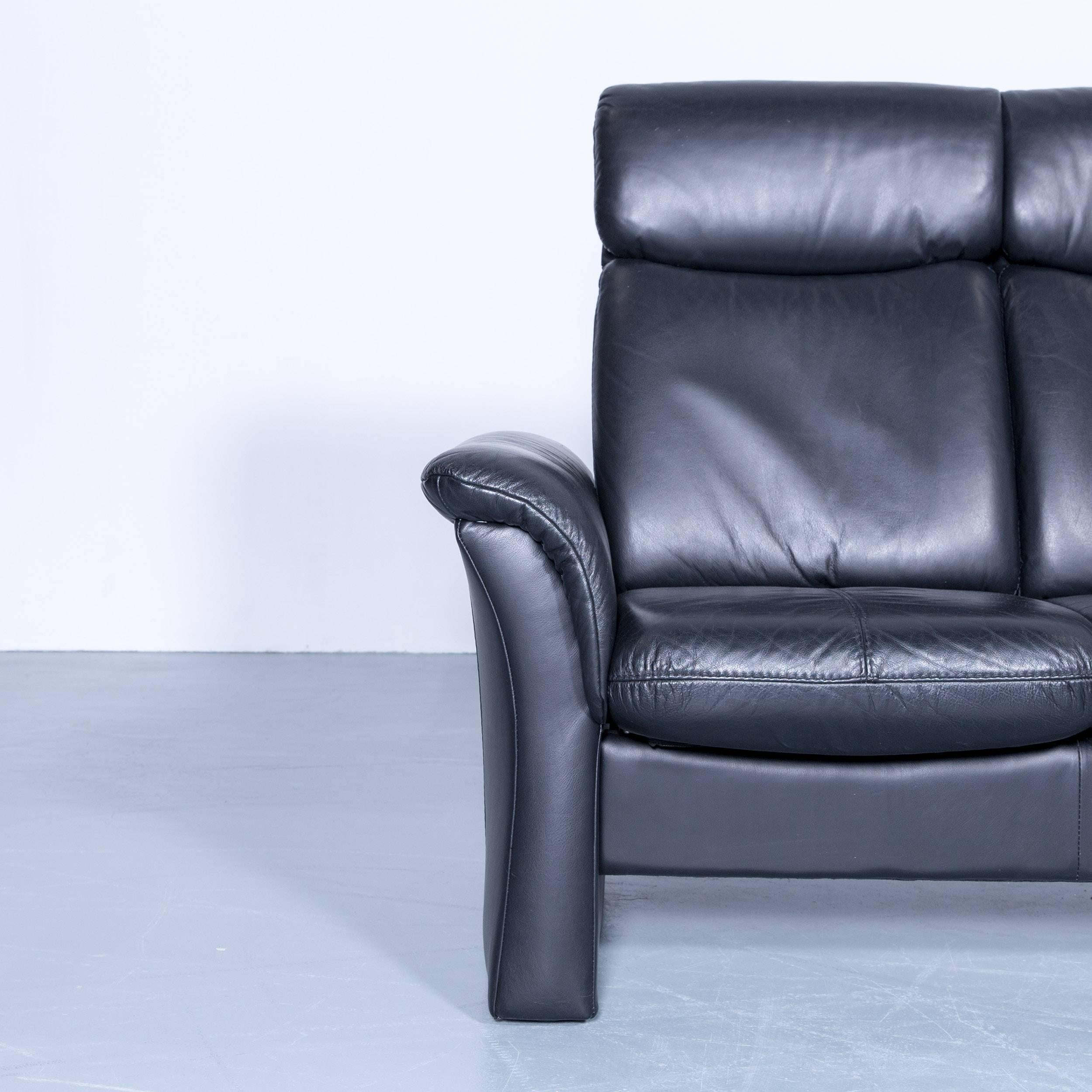 Designer three-seat sofa black relax couch leather function modern three-seat in a minimalistic and modern design, with convenient functions, made for pure comfort and flexibility.
