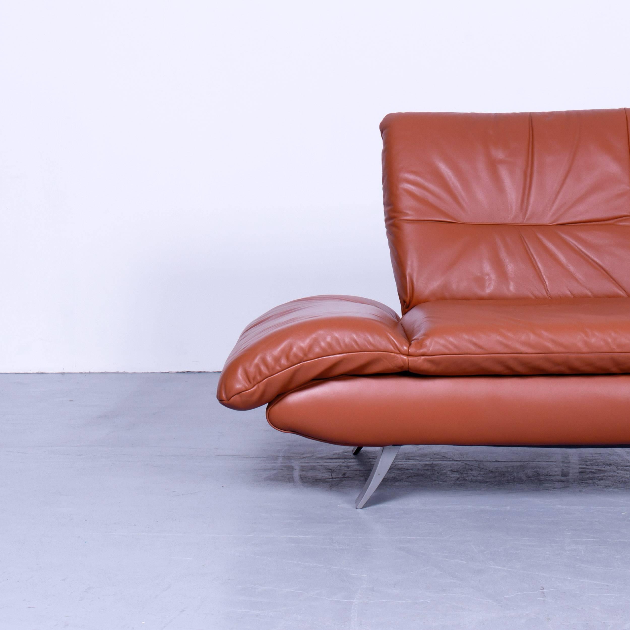 Koinor Rossini designer two-seat sofa orange red leather function modern two, in a minimalistic and modern design, with convenient functions, made for pure comfort and flexibility.