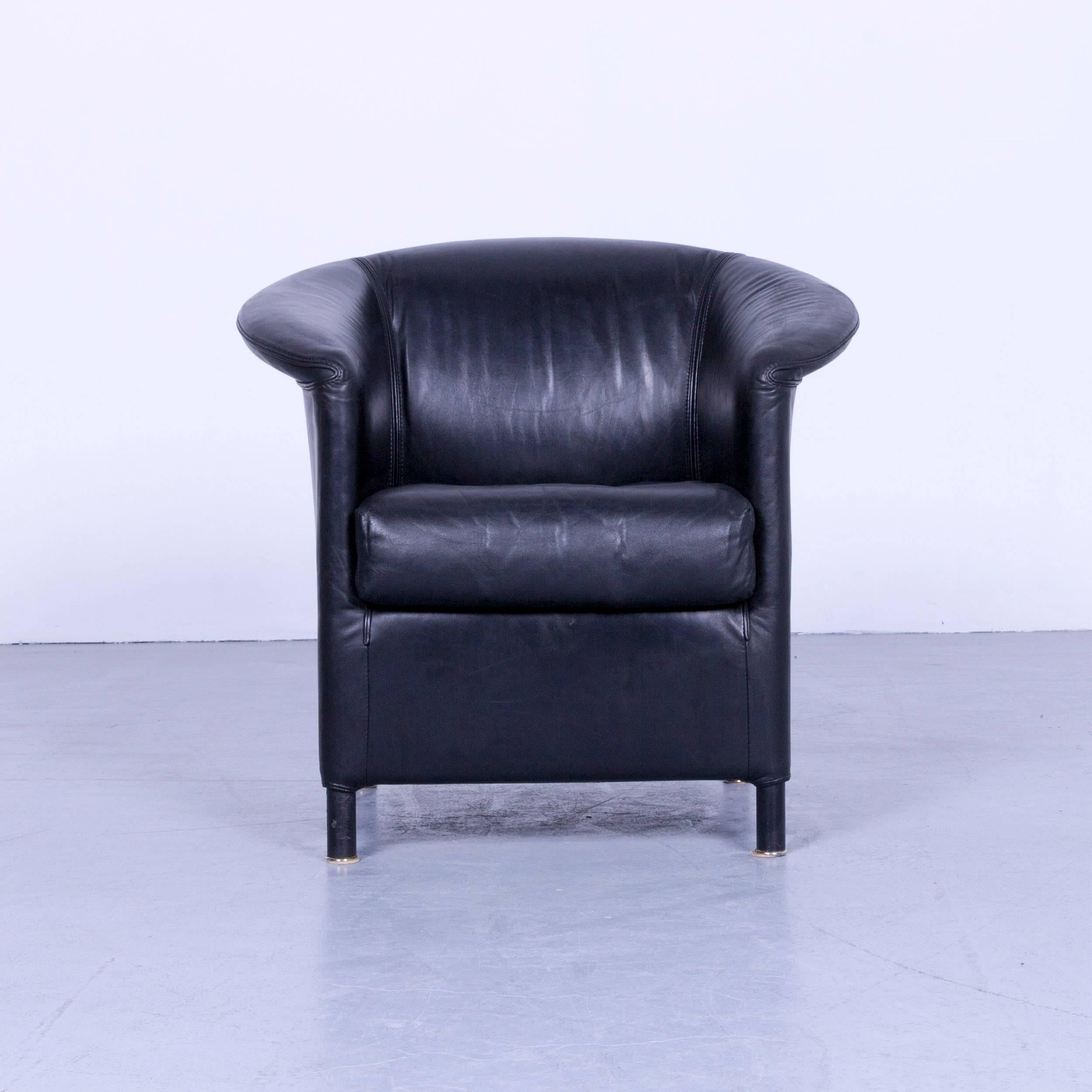 Black colored original Wittmann Aura designer leather armchair, in a minimalistic and modern design, made for pure comfort.