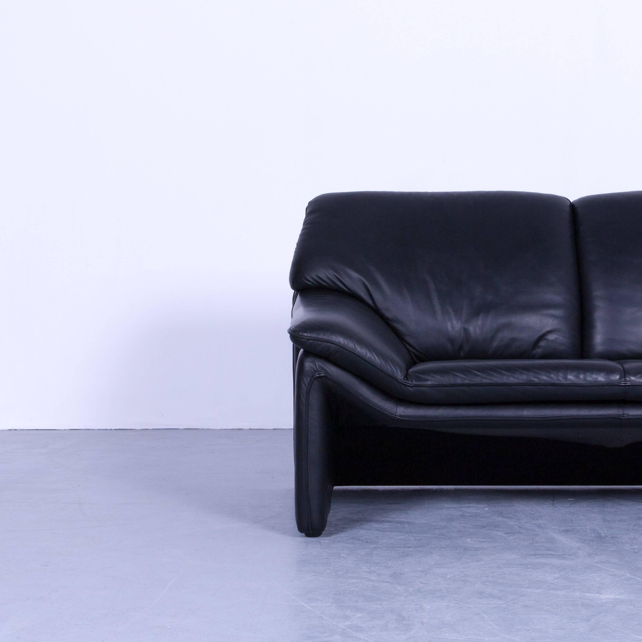 Black colored original Laauser Atlanta designer leather sofa, in a minimalistic and modern design, made for pure comfort.