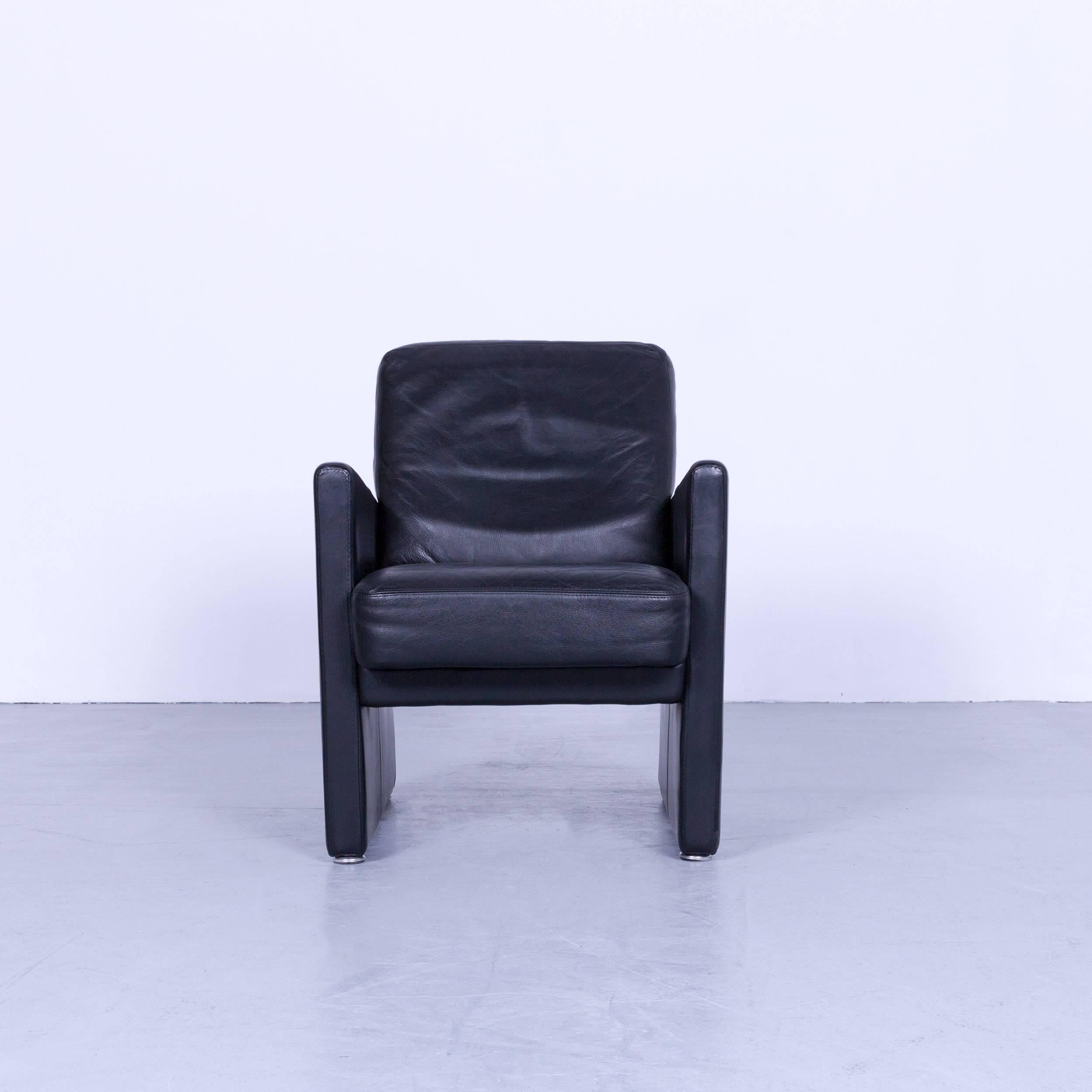 Brühl & Sippold designer armchair black leather simple form made in Germany, made for pure elegance and comfort.