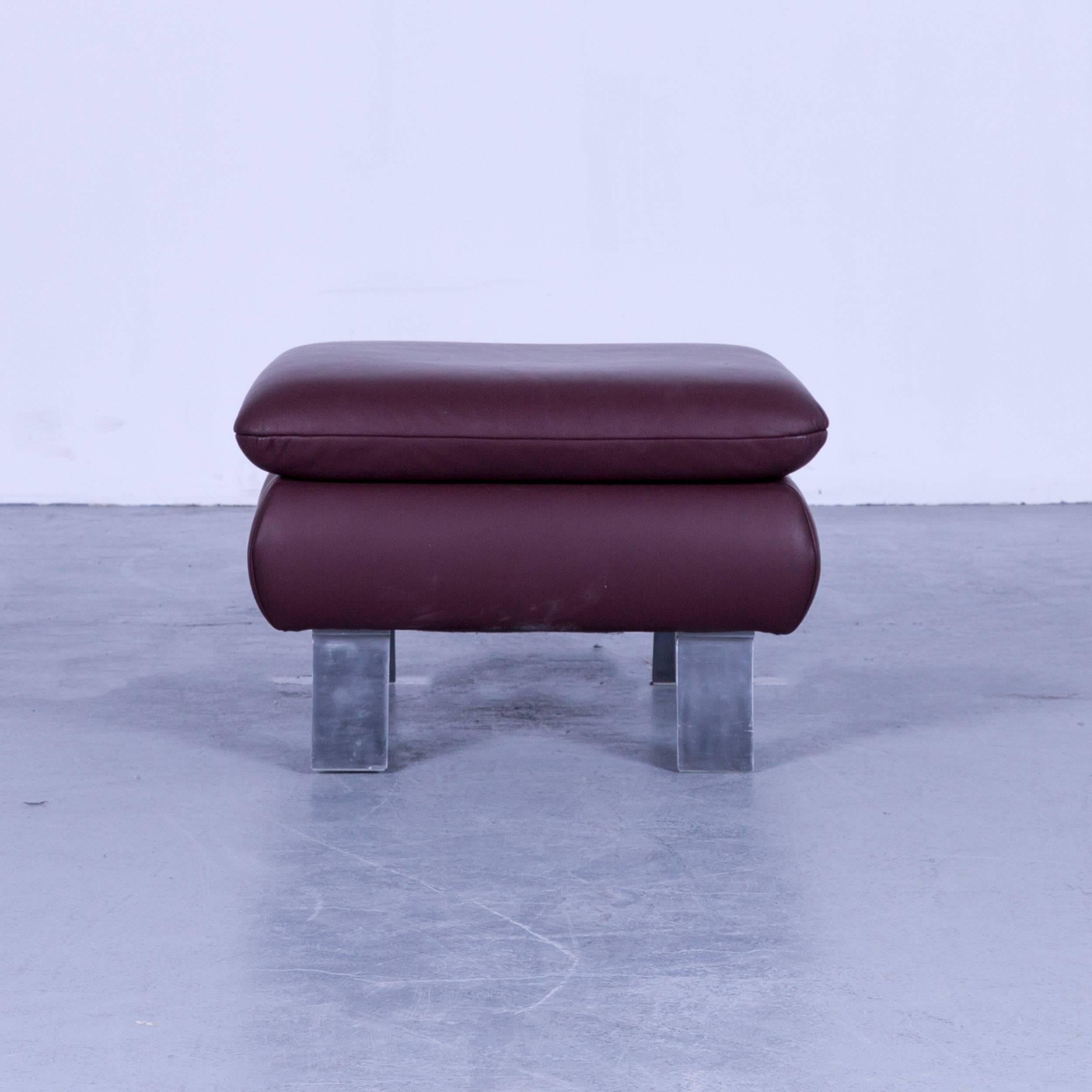 Koinor designer footstool Bordeaux wine red colored leather footrest pouf, made for pure comfort and flexibility.