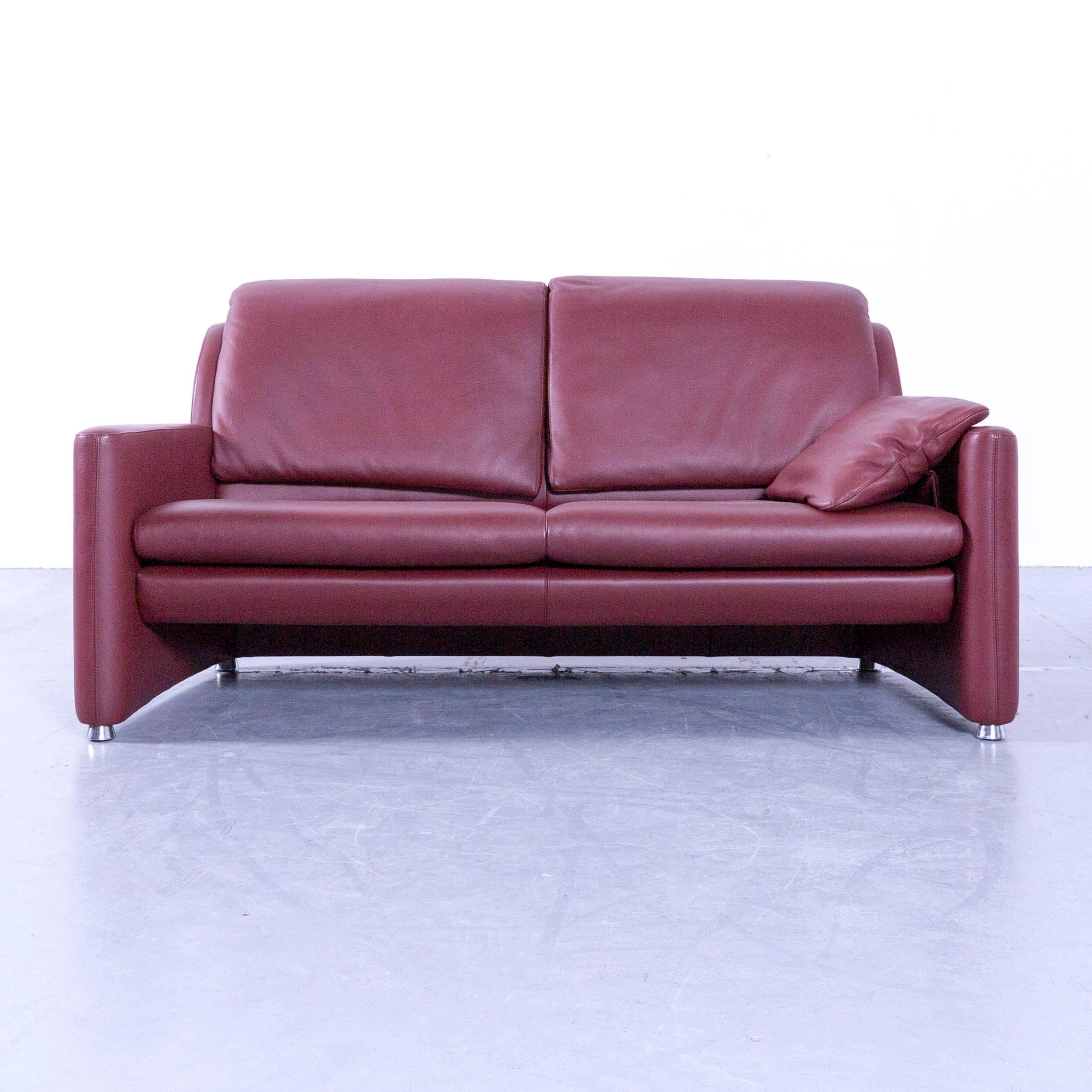 Red colored original Leolux Fidamigo designer leather sofa in a minimalistic and modern design, with convenient functions, made for pure comfort and flexibility.