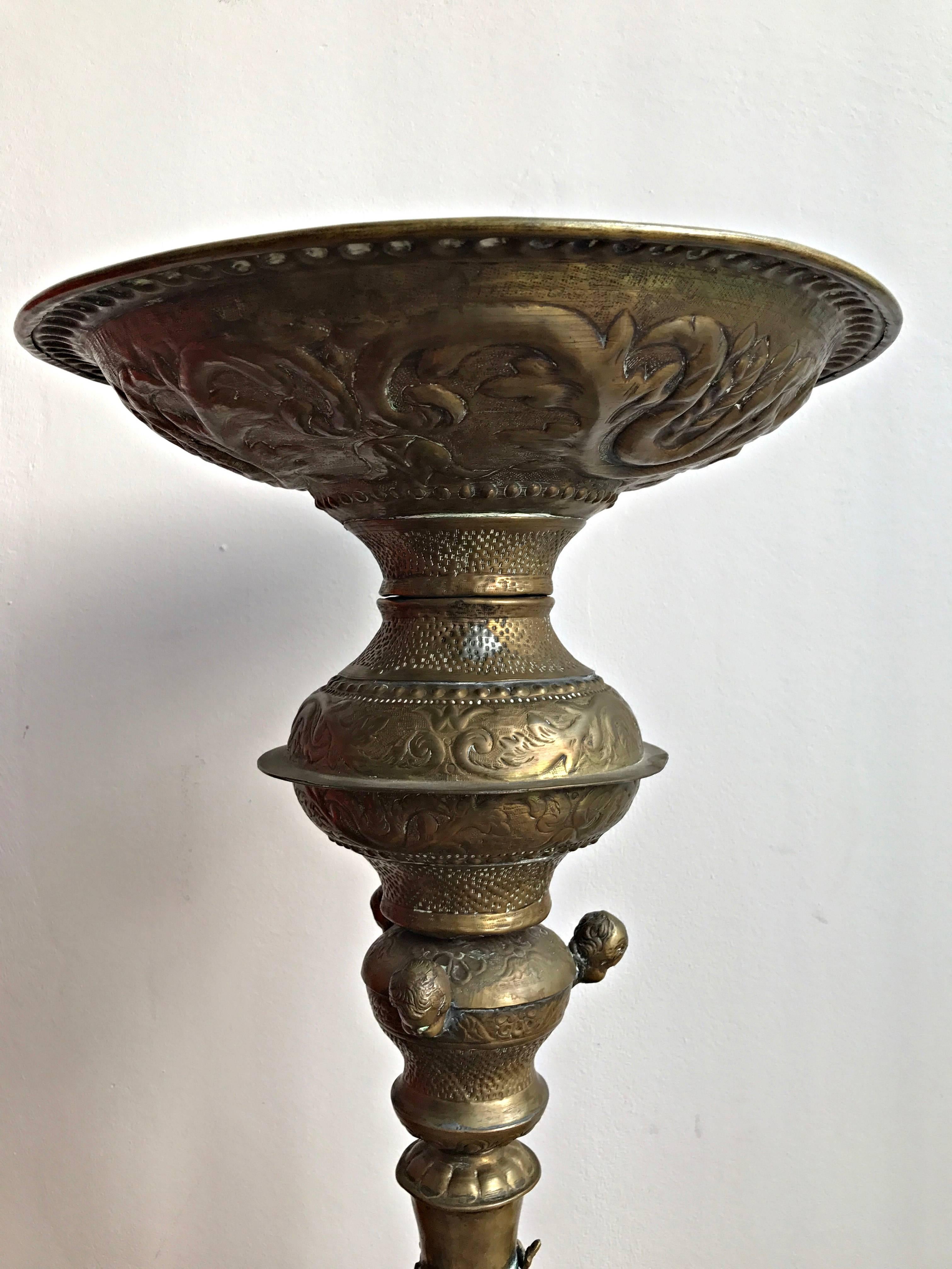 Fine original south German candlestick out of handmade brass, artistically decorated.