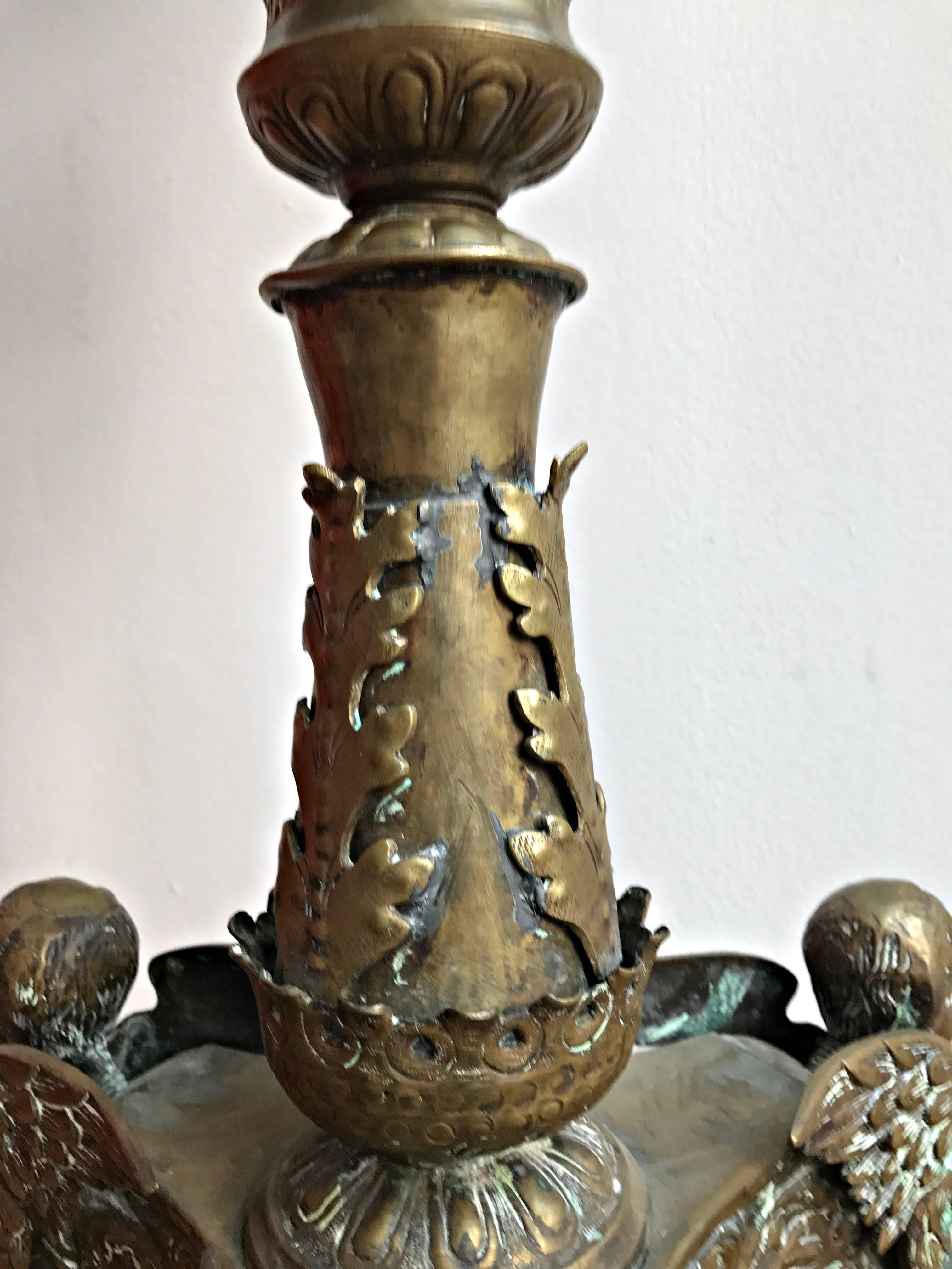 Hammered Great 18th Century Candlestick with Angel Heads For Sale