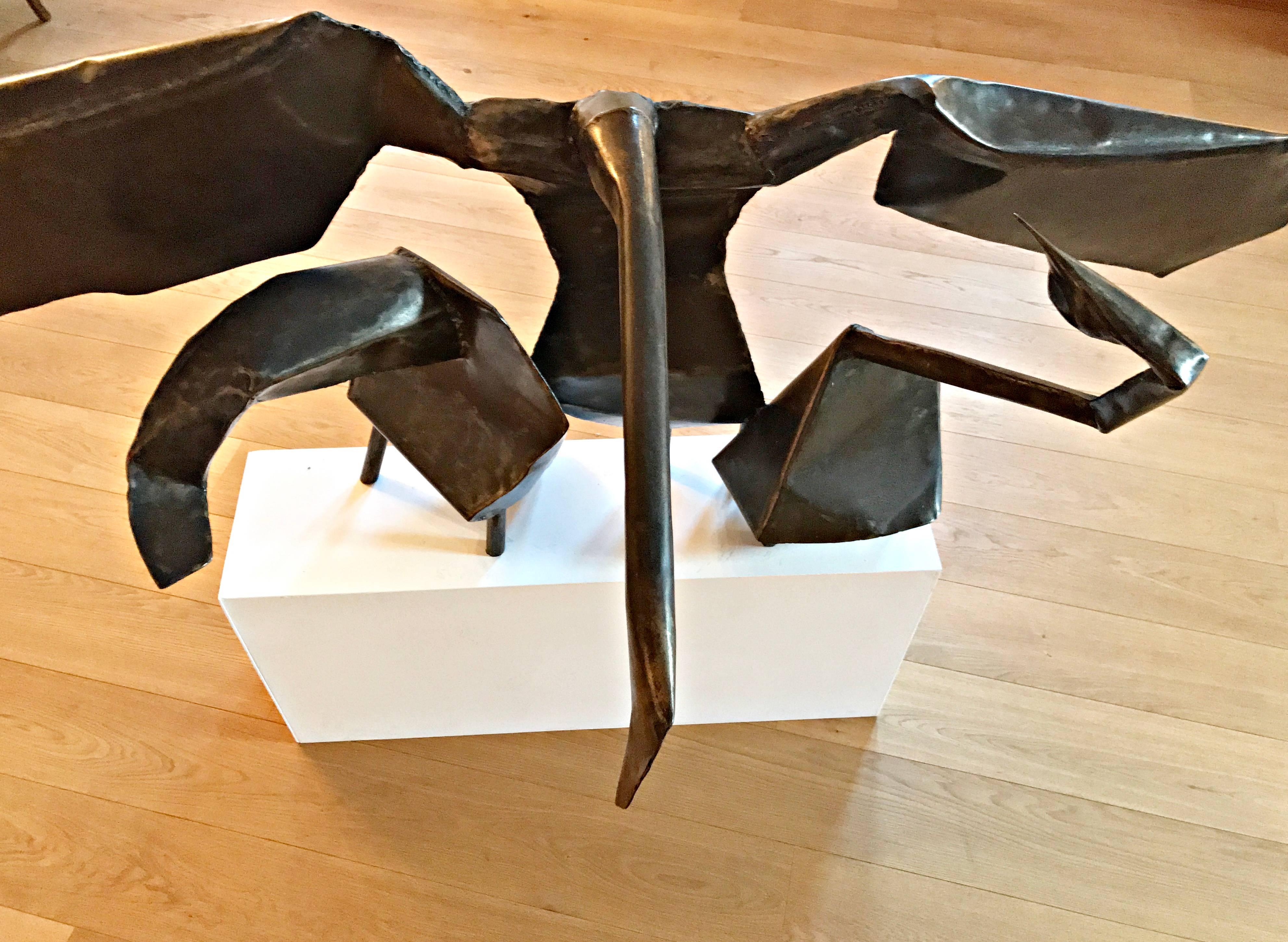 Iron plate, welded, patinated Signed on the reverse 
Measures: 83 x 165 x 72 cm
 Exhibited: 
Art in Steel, London in,1968 
On of the two black white picture show Joan Moore working on a sculpture with the swans in the background and the other