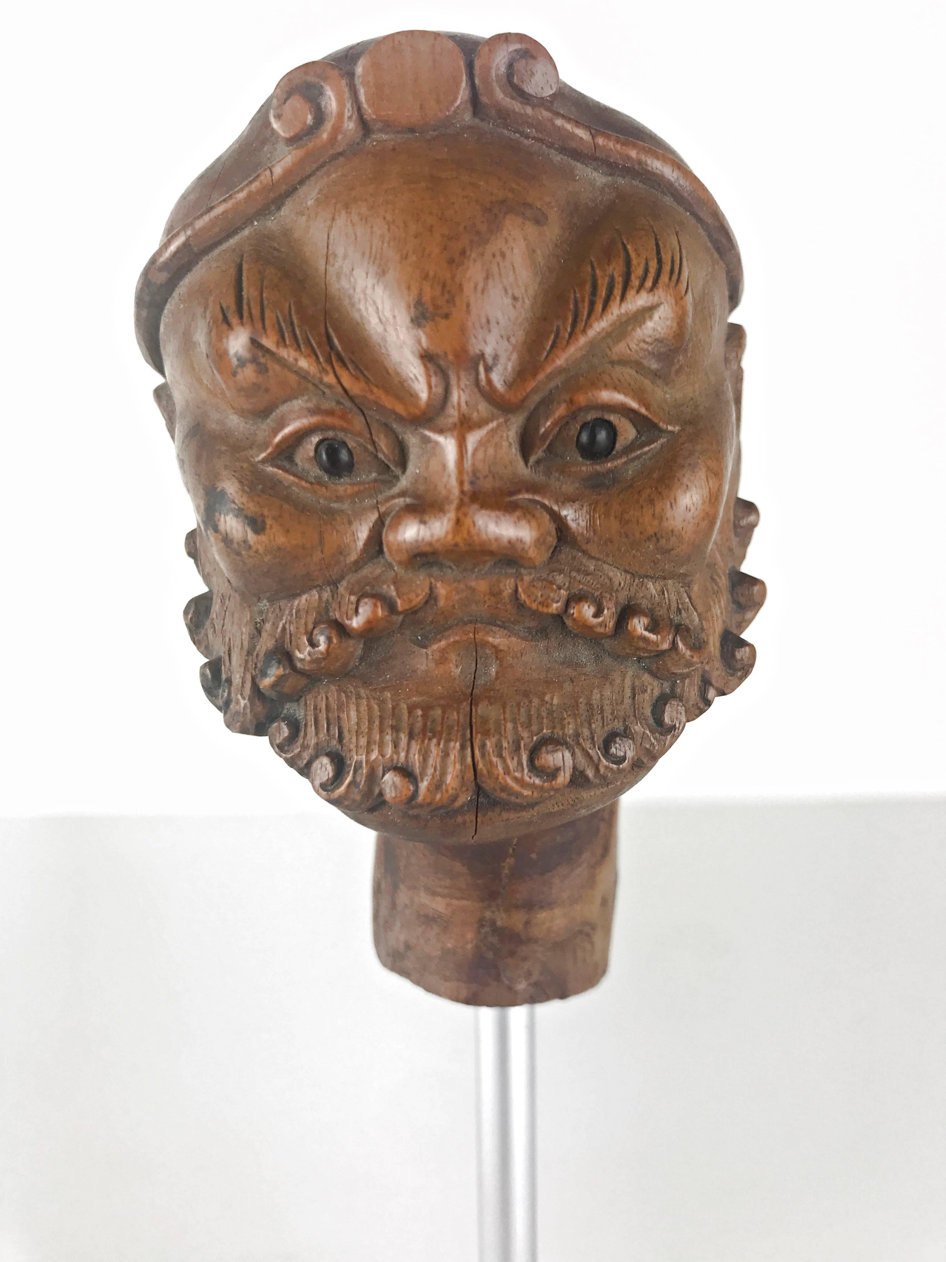 Fine carved Chinese head puppet in the form of a Buddhist arhatt mounted on a wooden base, 19th century.
Size with base is 7.5 inch (19 cm) high.