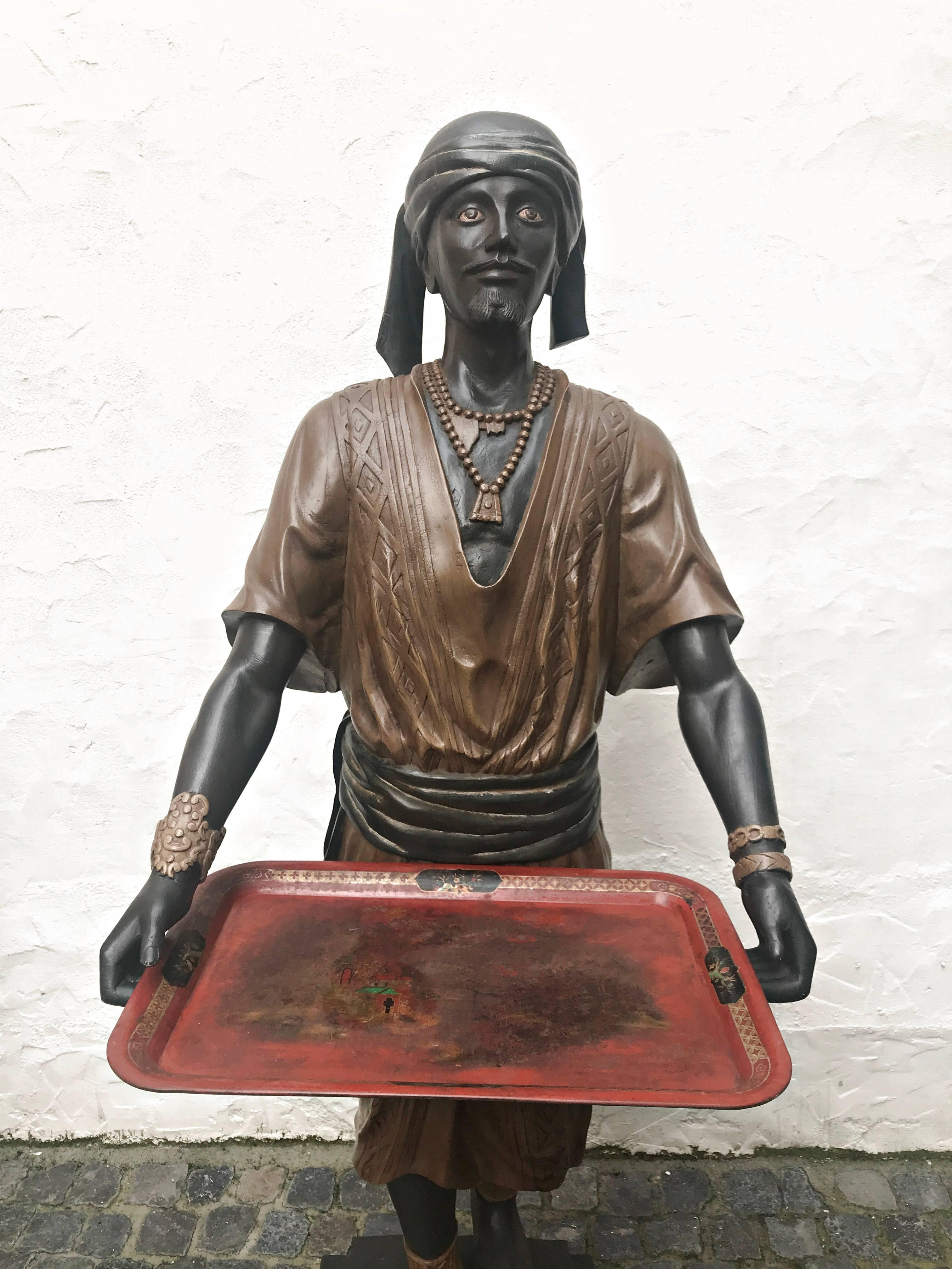 Rare, big and heavy, 114 lbs (52 kg.) wooden advertising sculpture.
The sculpture was carved and polychrome decorated circa 1890 and comes from a old German colonial country store.
The one carries a Chinese tray. The condition of the sculpture is