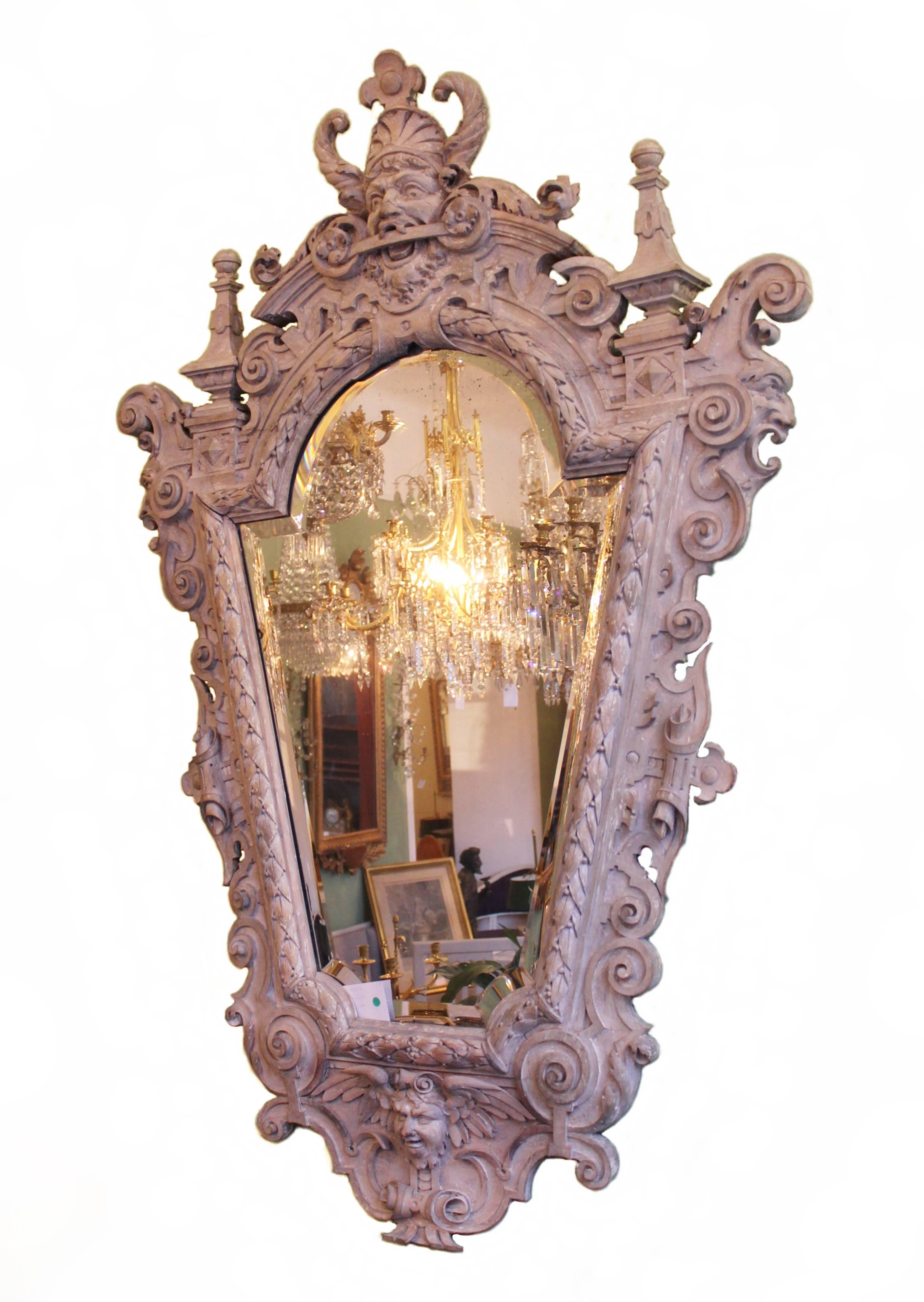 A truly imposing and beautiful grey painted wooden mirror. Richly carved and ornamental of superb quality. The mirror-glass is original. The mirror is quite hard to date but made in the 19th century or earlier.