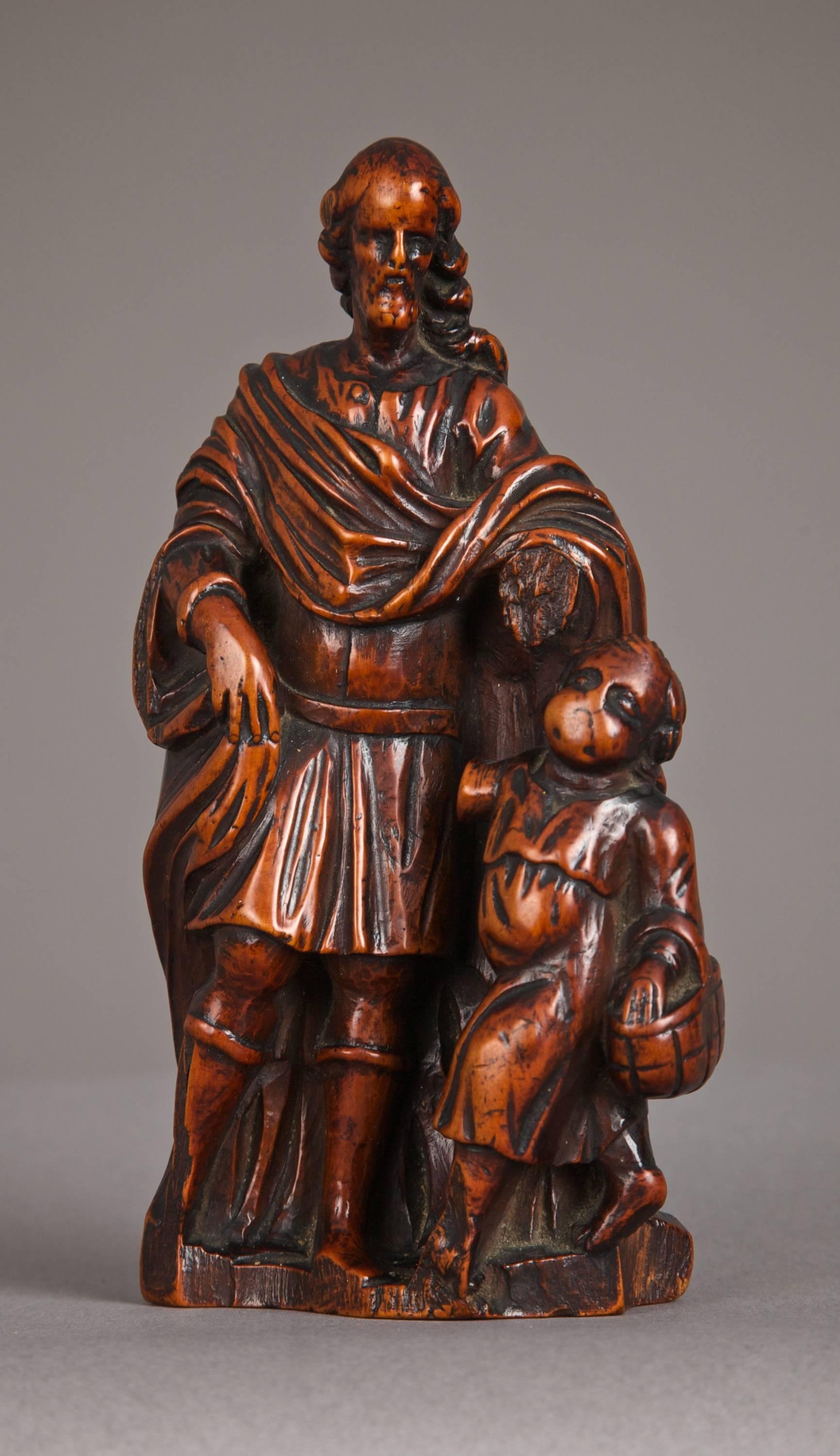 Late 16th century boxwood carving of St Joseph, circa 1580-1600.

The highly patinated figure of St Joseph with the infant Christ carrying a basket, carved from the solid in high relief. From the Flemish city of Antwerp.

This small boxwood