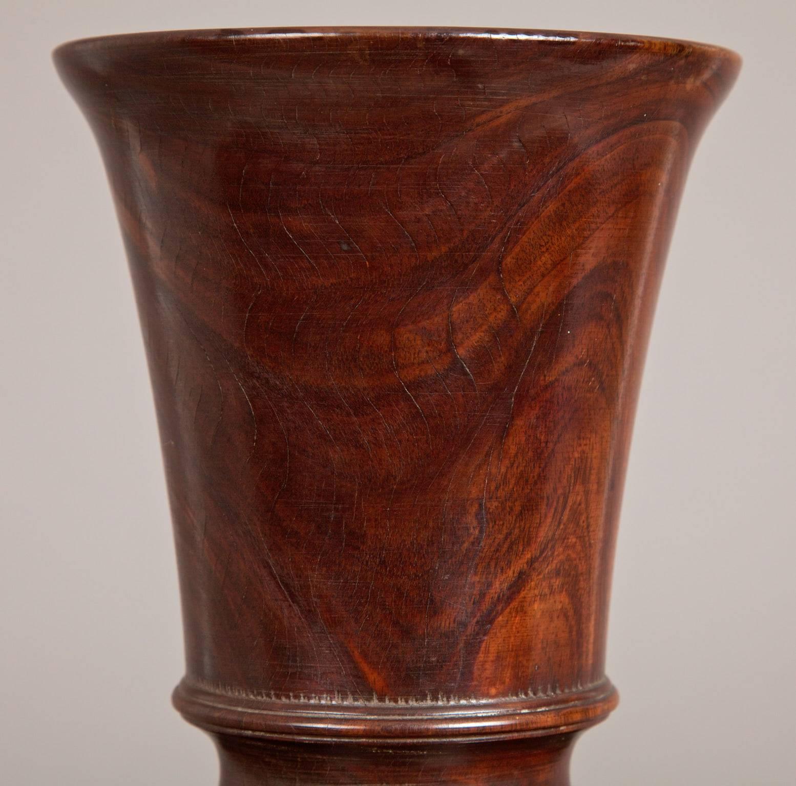 Late 19th century lignum vitae urn, English, circa 1860-1880.

The vase shaped vase or urn with high quality turning from solid Lignum Vitae with a tapering body and bulbous foot.
   