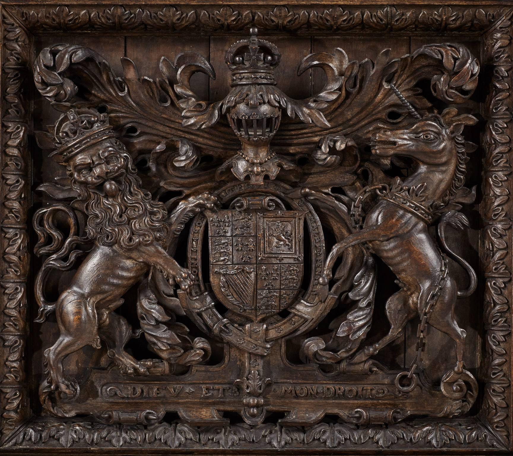 Carved oak overmantel featuring the Royal Arms of James I. 

The Royal Arms flanked by the Four Parts of the World, the figural designs taken from Philips Galle's 'Prosoprographia', with America depicted as a Carab Indian female warrior, Europa