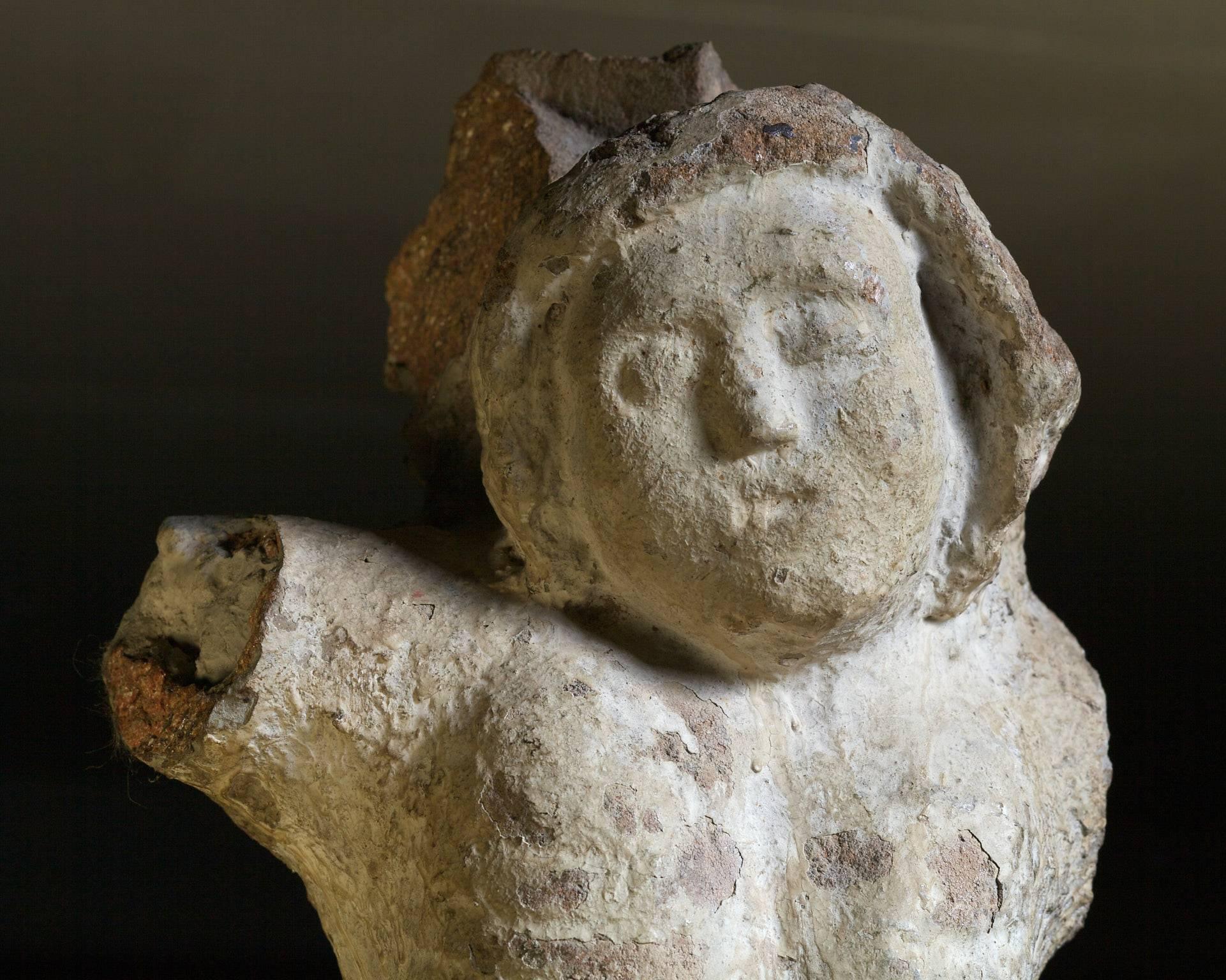 Mid-14th century granite corpus Christi, French, Breton, circa 1350-1360.

The amber colored granite sculpture of Christ on the Cross retaining traces of old painted polychrome ground decoration.
Now lightly weathered, originally part of an