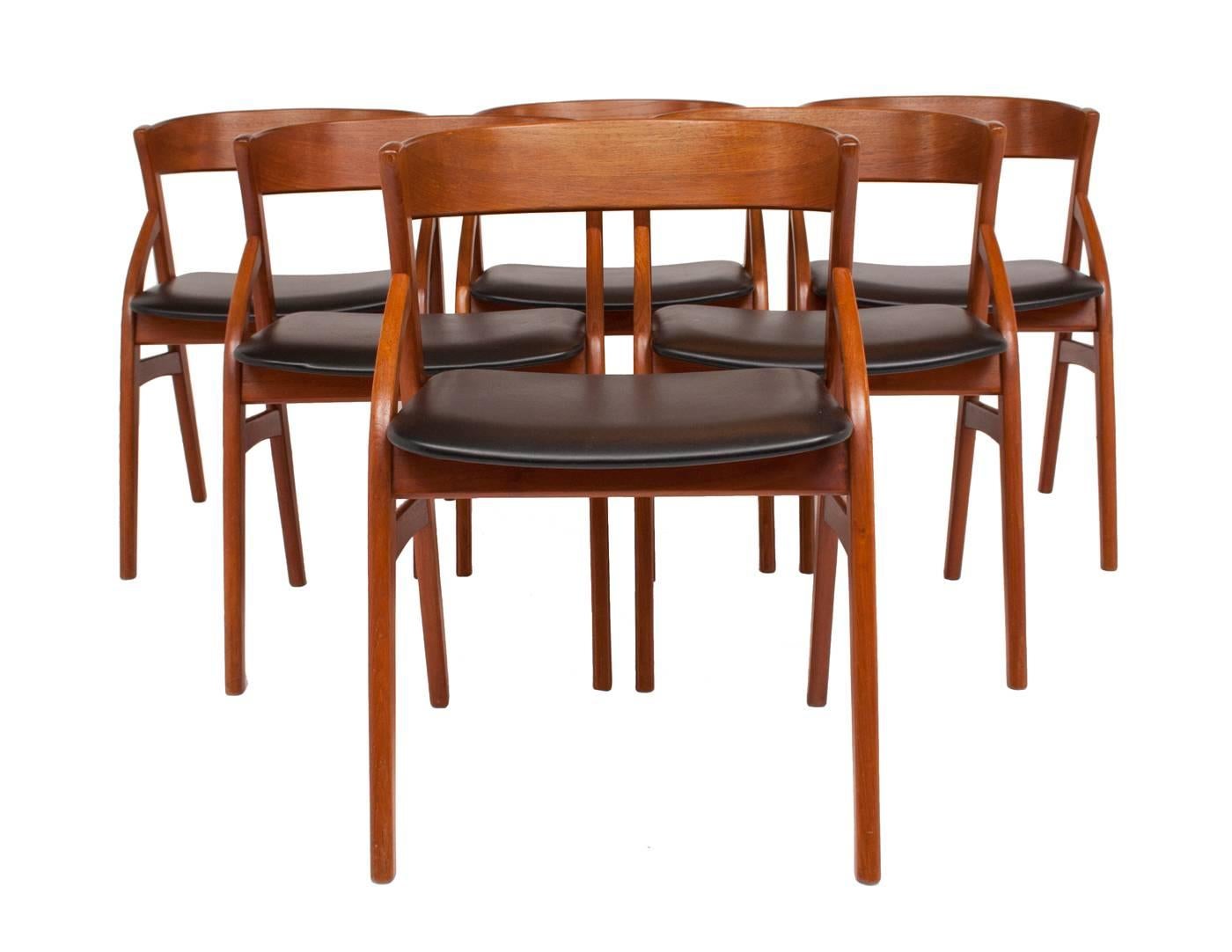 Set of six stylish teak dining chairs by Dyrlund. All chairs have been professionally restored and polished. One chair has very light discolouration to vinyl seat.