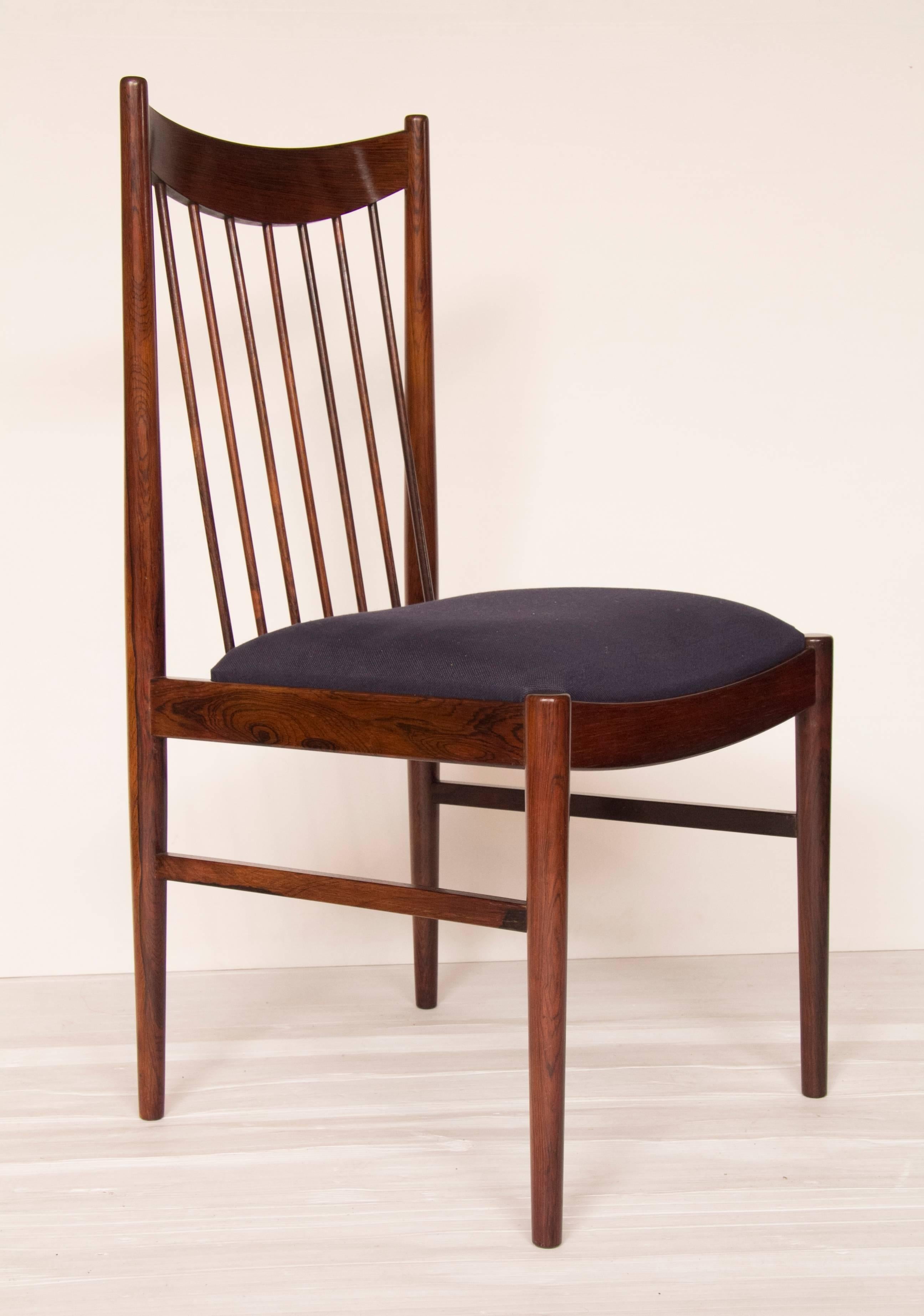 Set of six high back rosewood dining chairs designed by Arne Vodder for Sibast, newly upholstered in dark blue fabric.