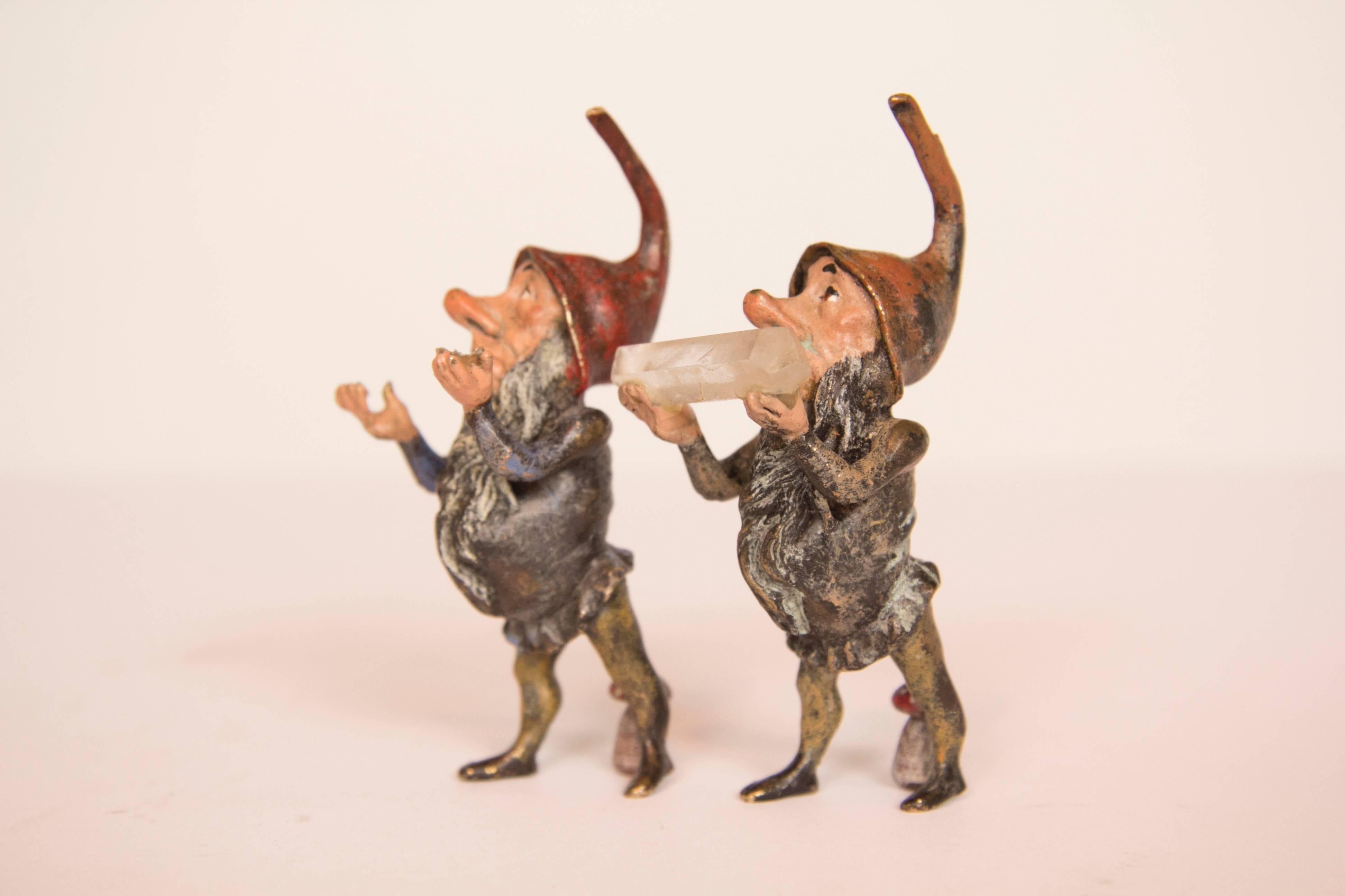 Two bronze crystal miner gnomes with crystals. One crystal is present but not fixed and one crystal miner playing cards.