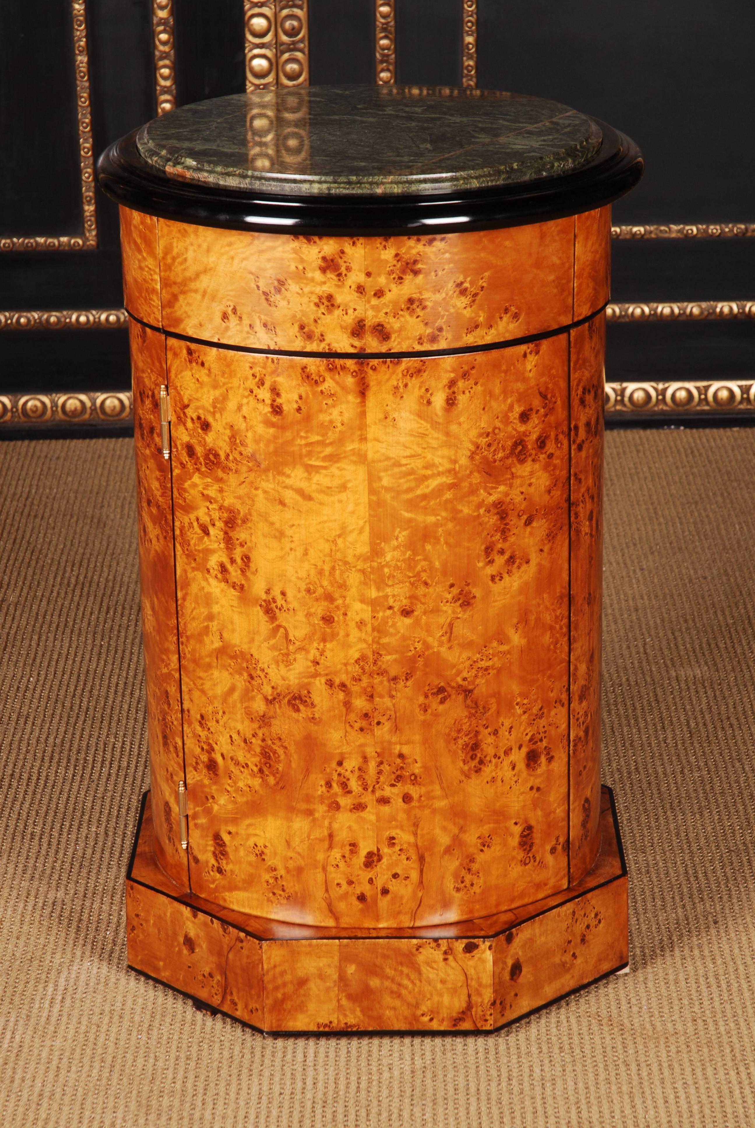 Maple root on solid conifers. Single-door cabinet in cylindrical shape. Corpus on corresponding frame. Gering marble top surface with light-gray grain. Partially ebonized. Interior shelving. Such a furniture can be exposed in the room.
Beautiful