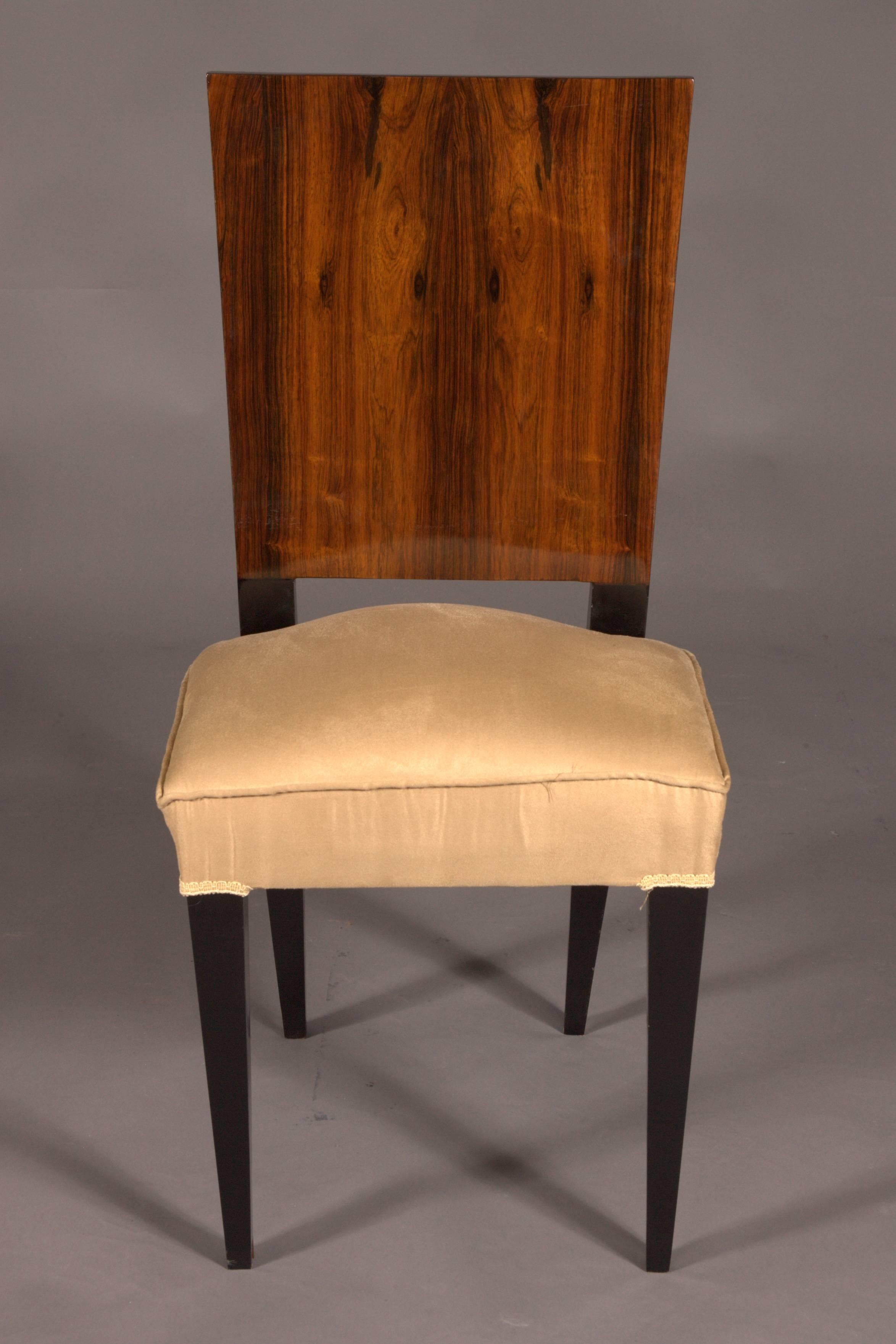 Massive beechwood with exotic Indian rosewood veneer.
Straight frame on tapering squares. High-rectangular, shoulder-shaped backrest frames. Seat surface upholstered and covered.  

Made exactly according to our original (from the time).