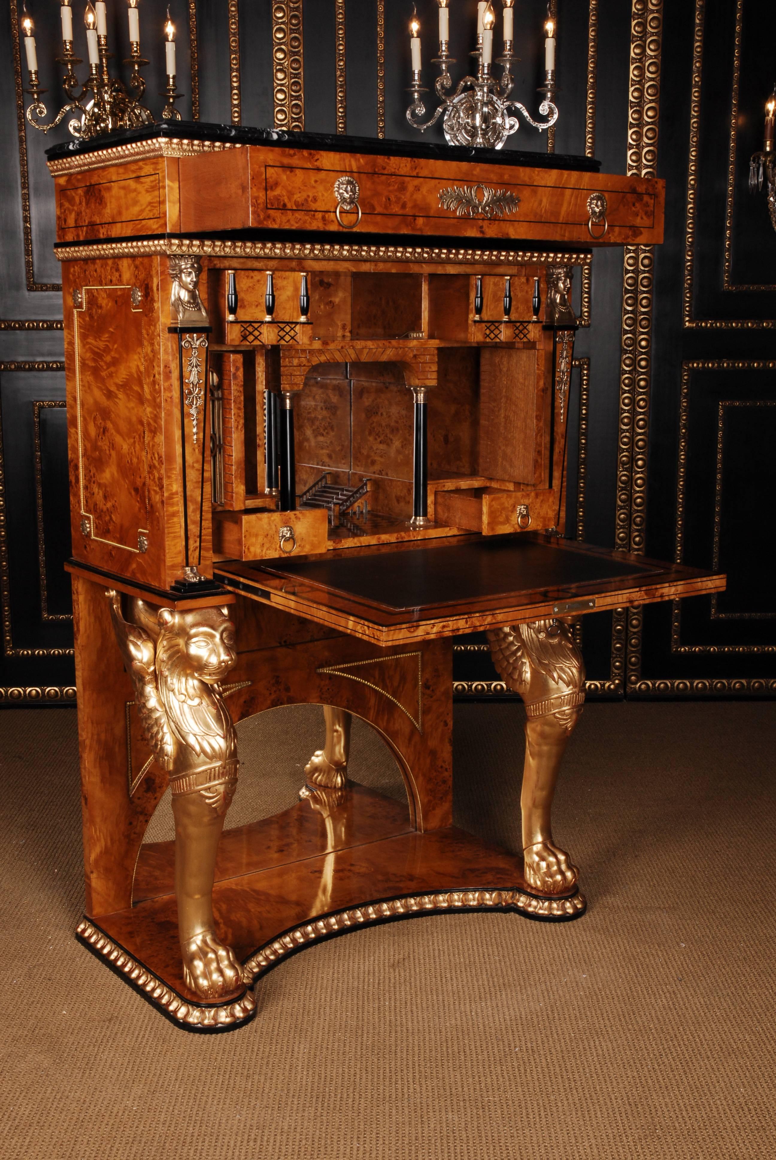 Bird’s-eye maple on solid pinewood. Carved, bowed pedestal foot, over it two winged moulded carved, gilded and colored hand painted Chimeras e from solid beechwood, arranged with left and right alignment. The right-angled body with withdrawable