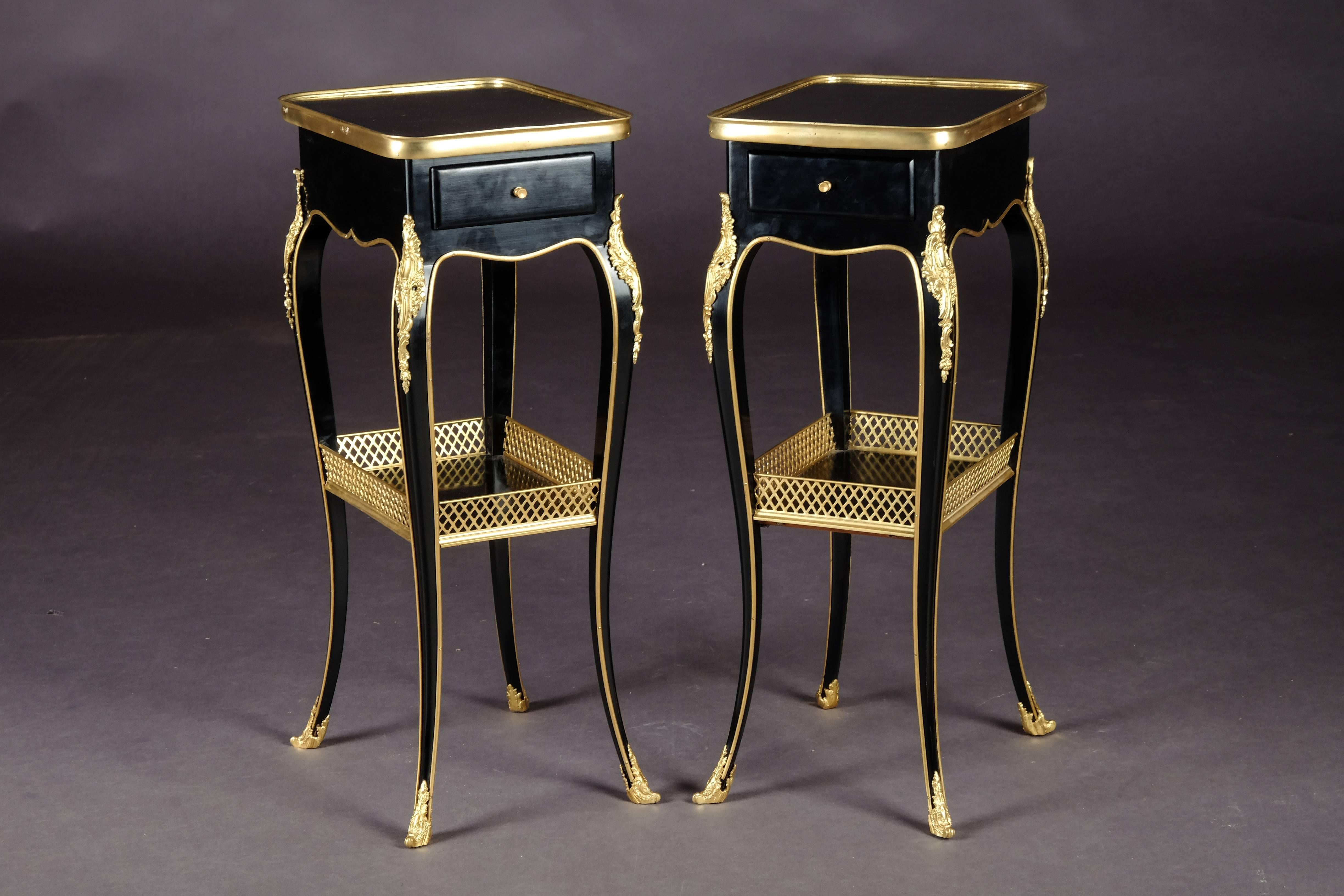 Solid beechwood ebonized and polished. Very fine, floral, bronze fittings. Embracing frame box on high slightly curved legs with intermediate tray connected in sabots. Slightly protruding top plate in brass frame. Beautiful patina, with shellac