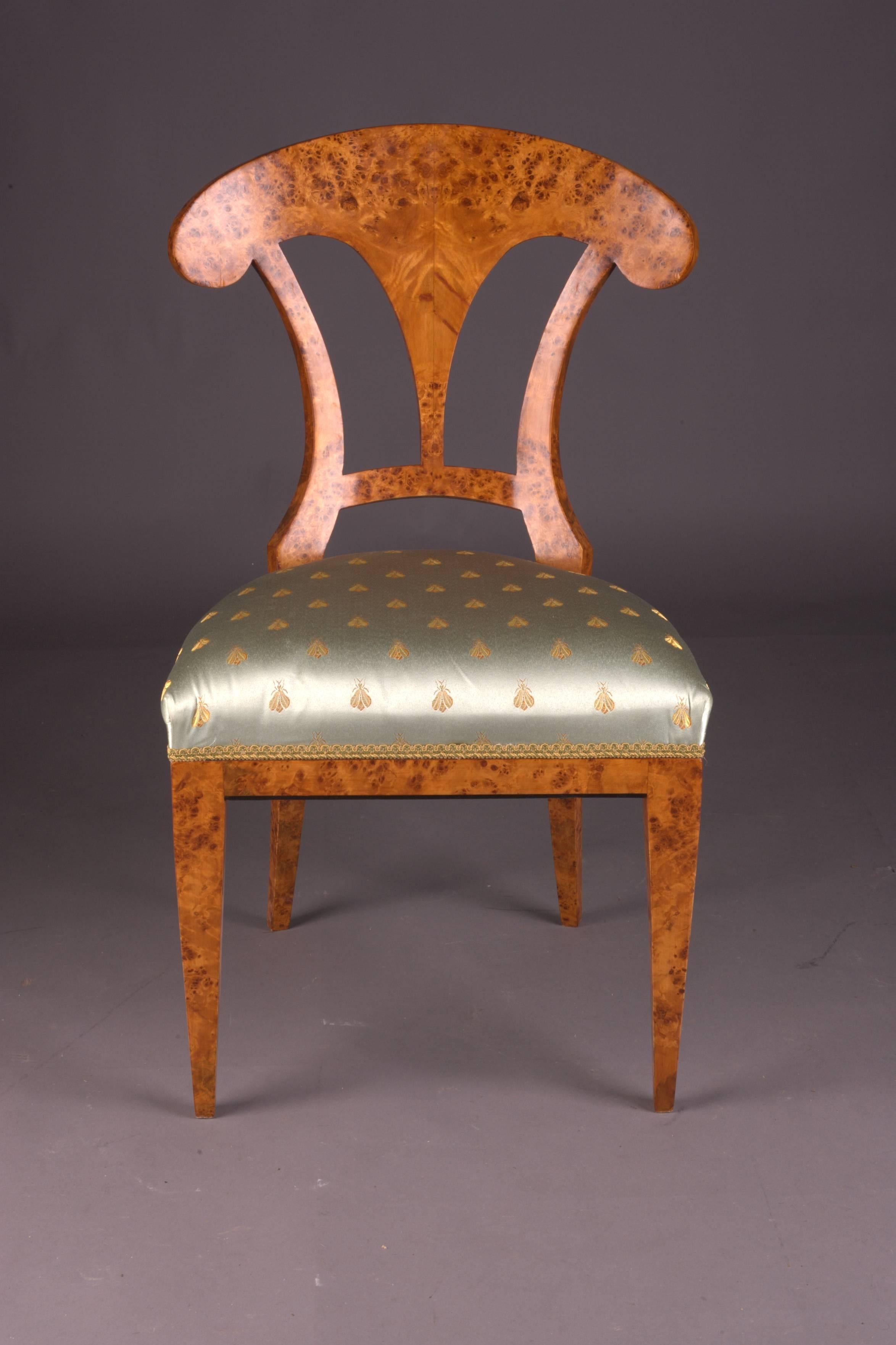 Solid beechwood with maple root veneer. Seat classical.
Upholstered.