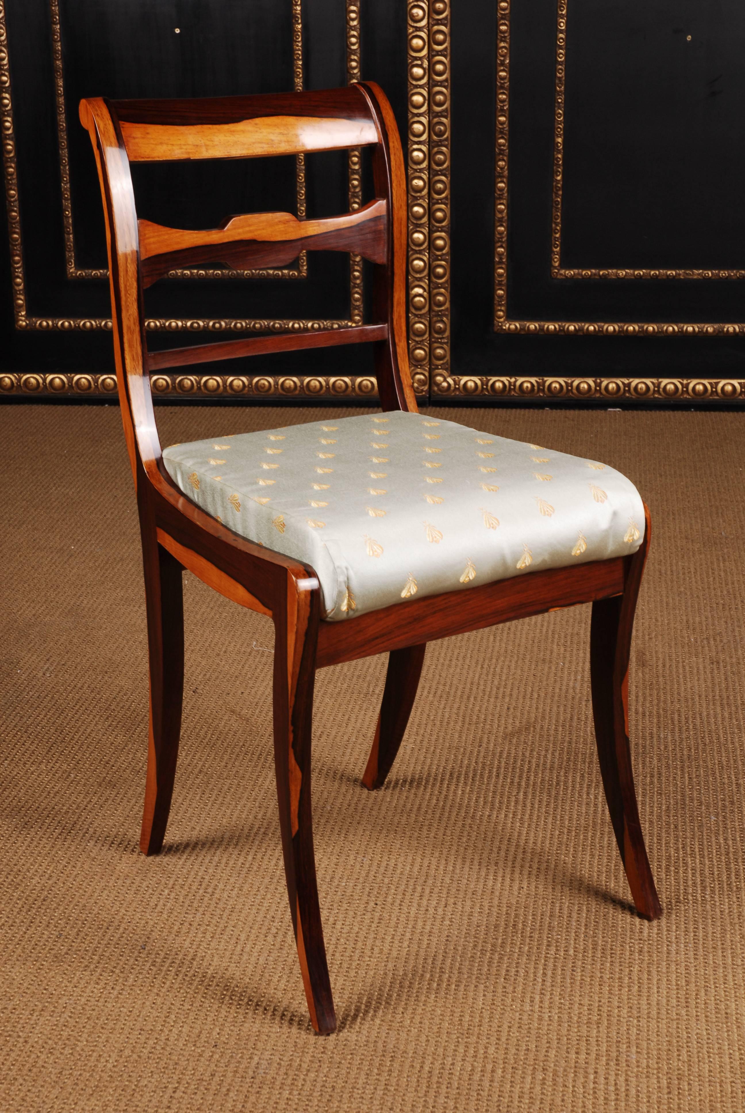 Solid beechwood with Palisander veneer. Elegantly curved saber-shaped legs in a straight frame. High-arched curved backrest, in the center medallion-shaped middle bridge. A very nice chair with a perfect proportion. Classically upholstered seat,