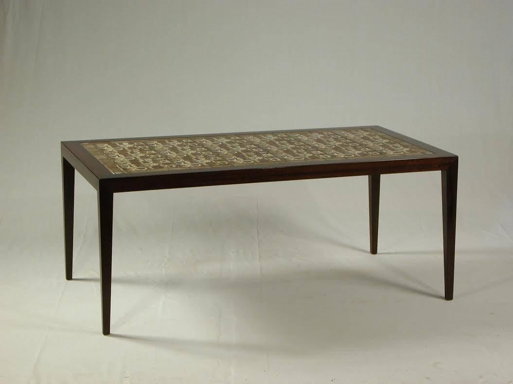 Rosewood Coffee table designed by Severin Hansen for Haslev Møbelsnedkeri with Niels Thorsson tiles made and branded by Royal Copenhagen, Denmark.

The Coffee table has been restored and has only small signs of age and use.

 See Royal Copenhagen