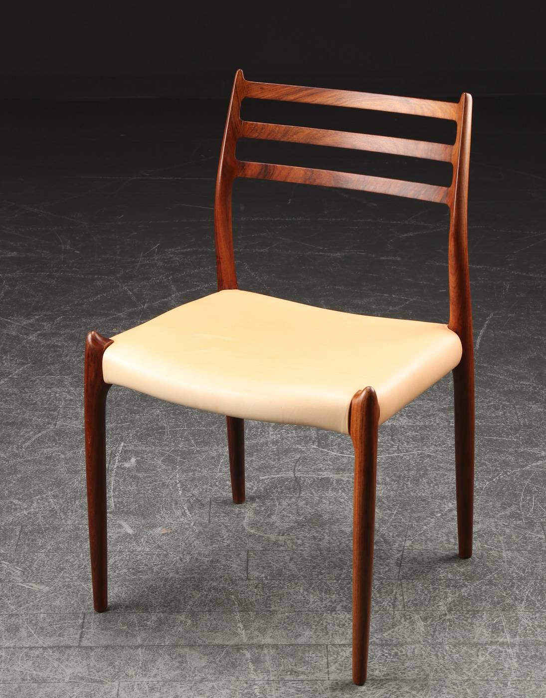 This model 78 dining chair was designed in 1954 by Niels O. Møller for J.L. Møllers Møbelfabrik. 

The chair is organically-shaped and is evidence of what great designers and brilliant cabinetmakers can achieve.

The chair is newly upholstered in