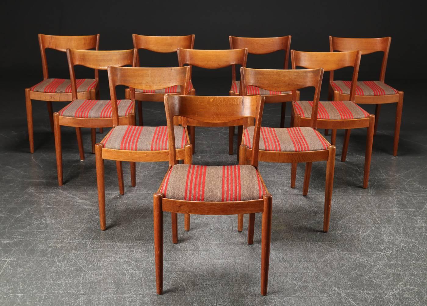 A rare set of ten dining chairs designed in the 1950s by Ib Kofod-Larsen for Slagelse Møbelværk.

The chairs are in good condition and has well designed shapes from the 1950s, with lots of the desirable patina that only age can give to a chair and