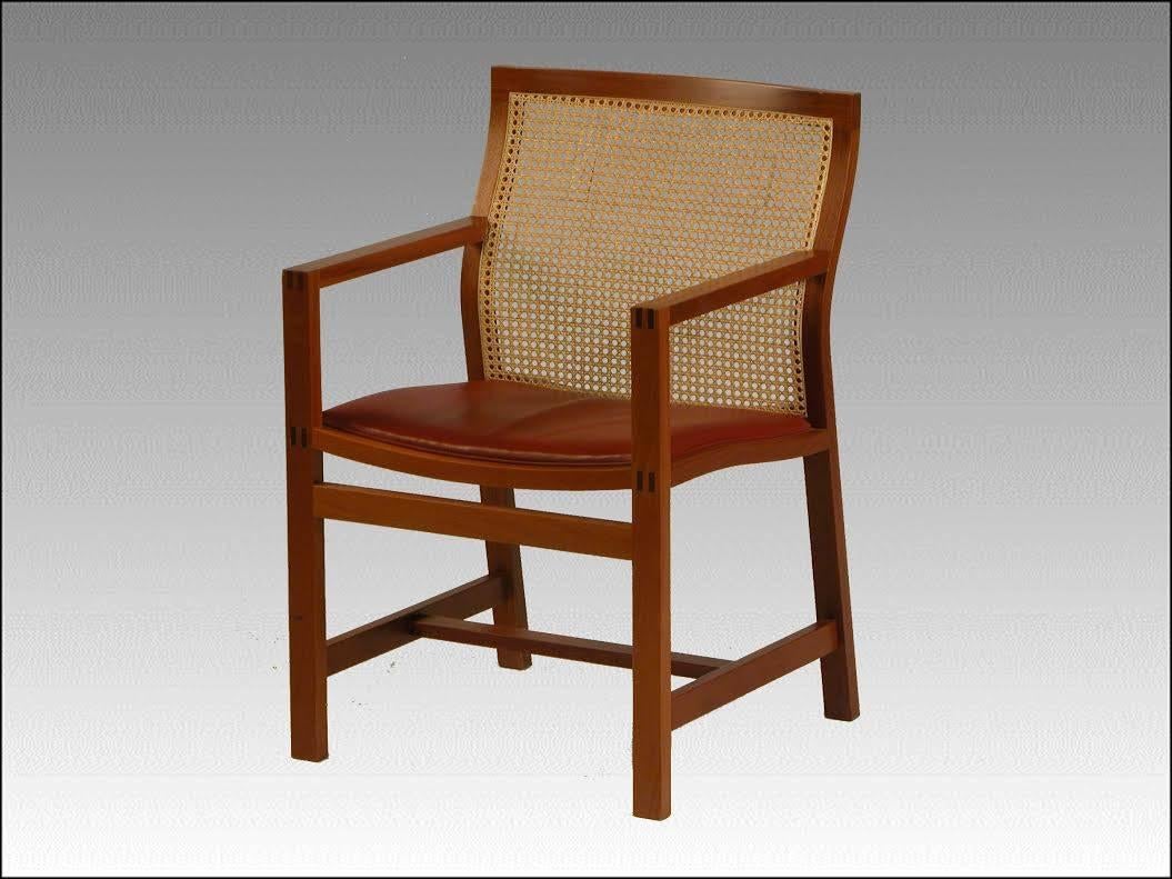 This pair of chairs, model 7512, was designed for Fredericia Furniture A/S in 1981 as part of the Classic Kings Furniture series, which has been designed since 1969, named such because the Danish King Frederik IX received some of the models as gift