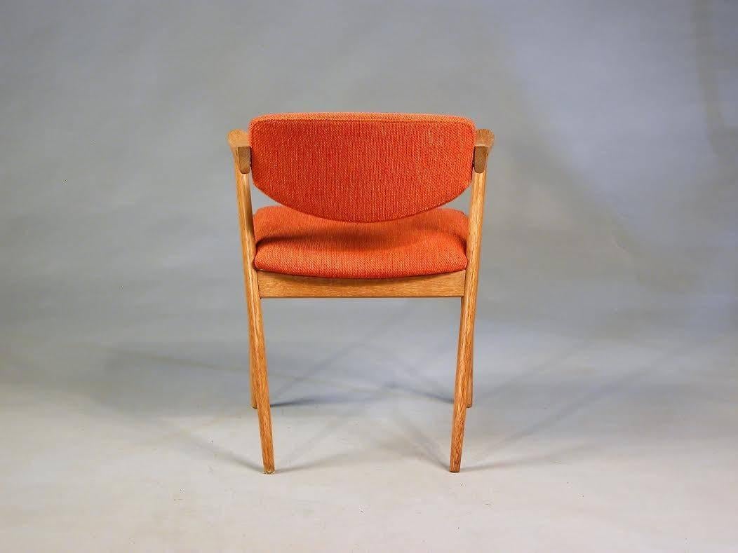 Danish 1960s Two Kai Kristiansen Model 42 Dining Chairs in Oak and Orange Fabric