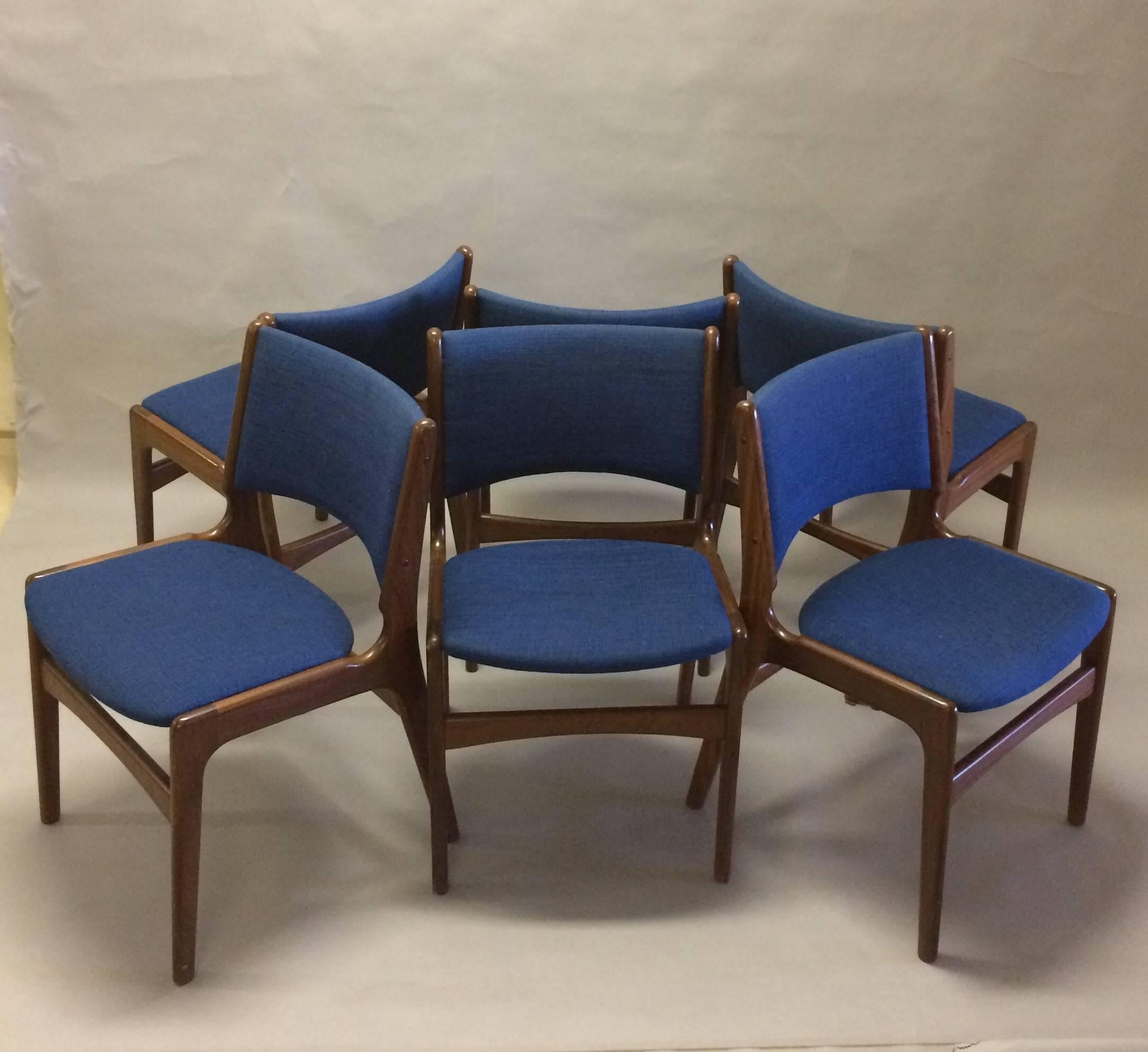 Set of 12 Erik Buch dining chairs made by Odense Maskinsnedkeri.

The chairs feature a solid teak frame and are as all of Erik Buchs chairs characterized by high-quality materials, solid craftsmanship, Scandinavian aesthetic and not least a