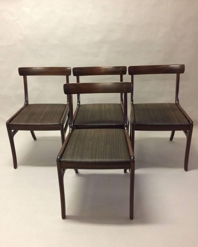 This set of four mahogany Rungstedlund dining chairs designed by Ole Wanscher were produced during the 1960s and 1970s by Poul Jeppesen Furniture. 

The dining chairs are part of the Rungstedlund dining furniture series designed by Ole Wanscher and