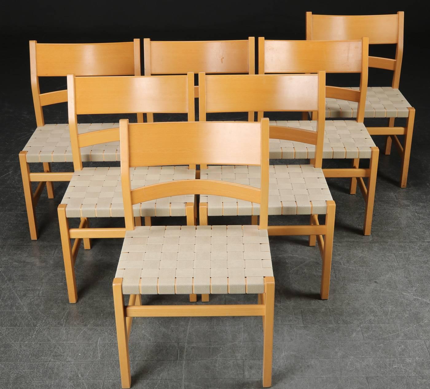 1980s set of seven Koldinghus dining chairs named after the old Danish castle Koldinghus designed by Hans J. Wegner in conjunction with a major restauration of the castle in the late 1980´s.

The beech chairs have the well known elegant Wegner