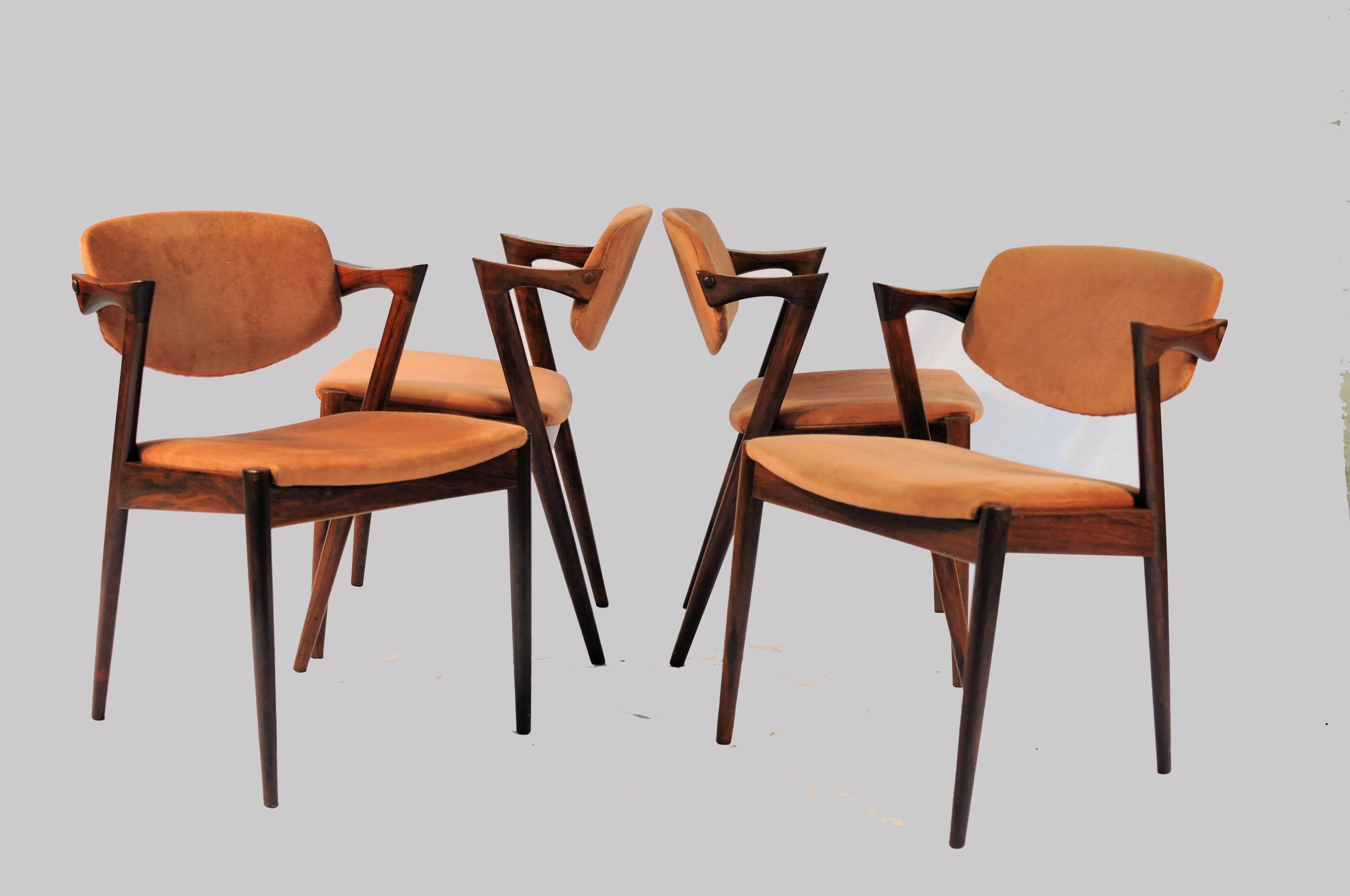 Model 42 teak dining chairs with adjustable backrest with different types of upholstery by Kai Kristiansen for Schous Møbelfabrik.

The chairs have Kai Kristiansens typical light and elegant design that make them fit in easily where you want them in