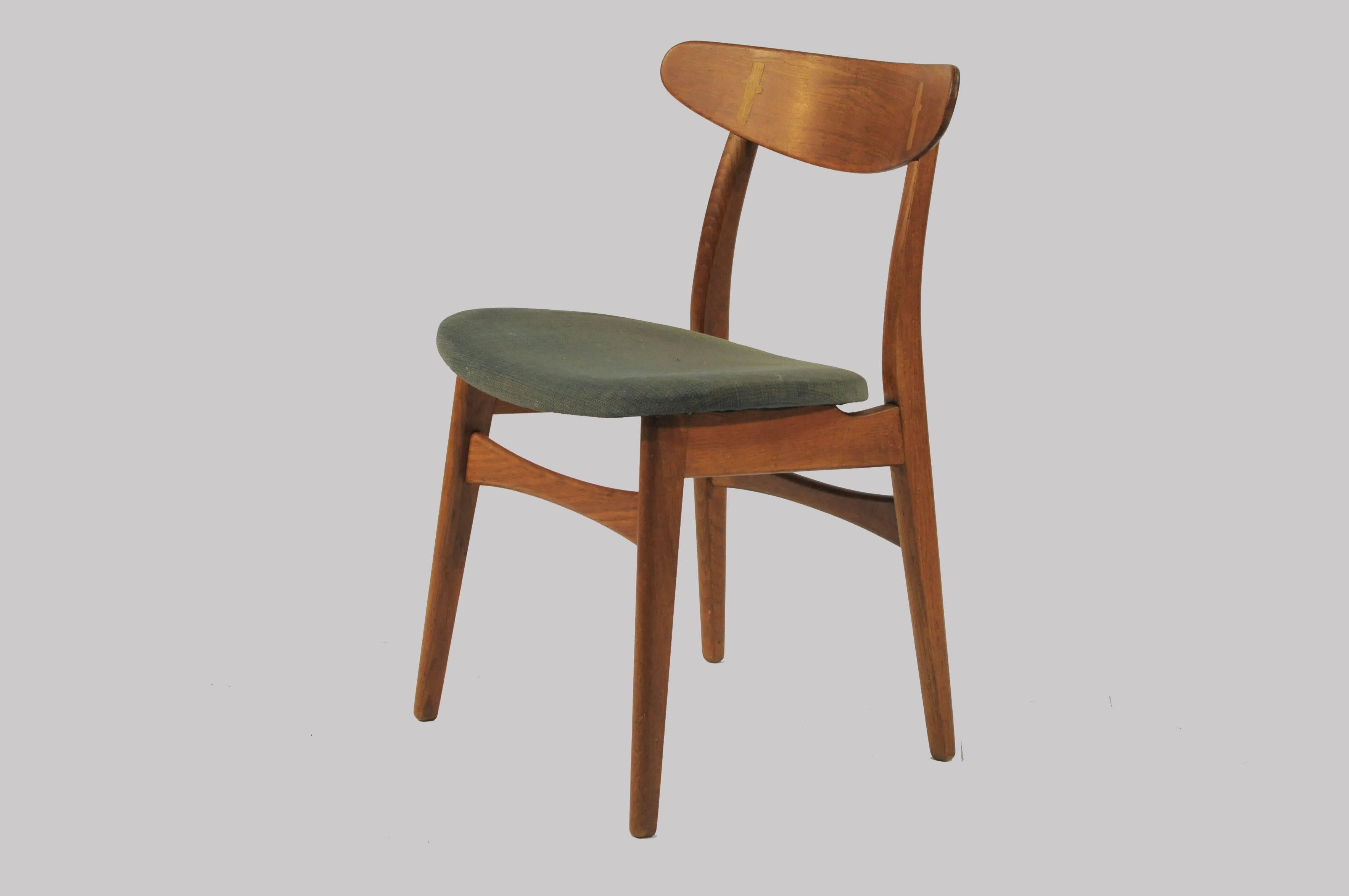A set of eight Hans Wegner dining chairs designed in 1952 for Carl Hansen & Søn. 

The simple yet sophisticated design has become an iconic Classic among Wegners chairs. The exposed joint between the teak backrest and the oak rear post is a