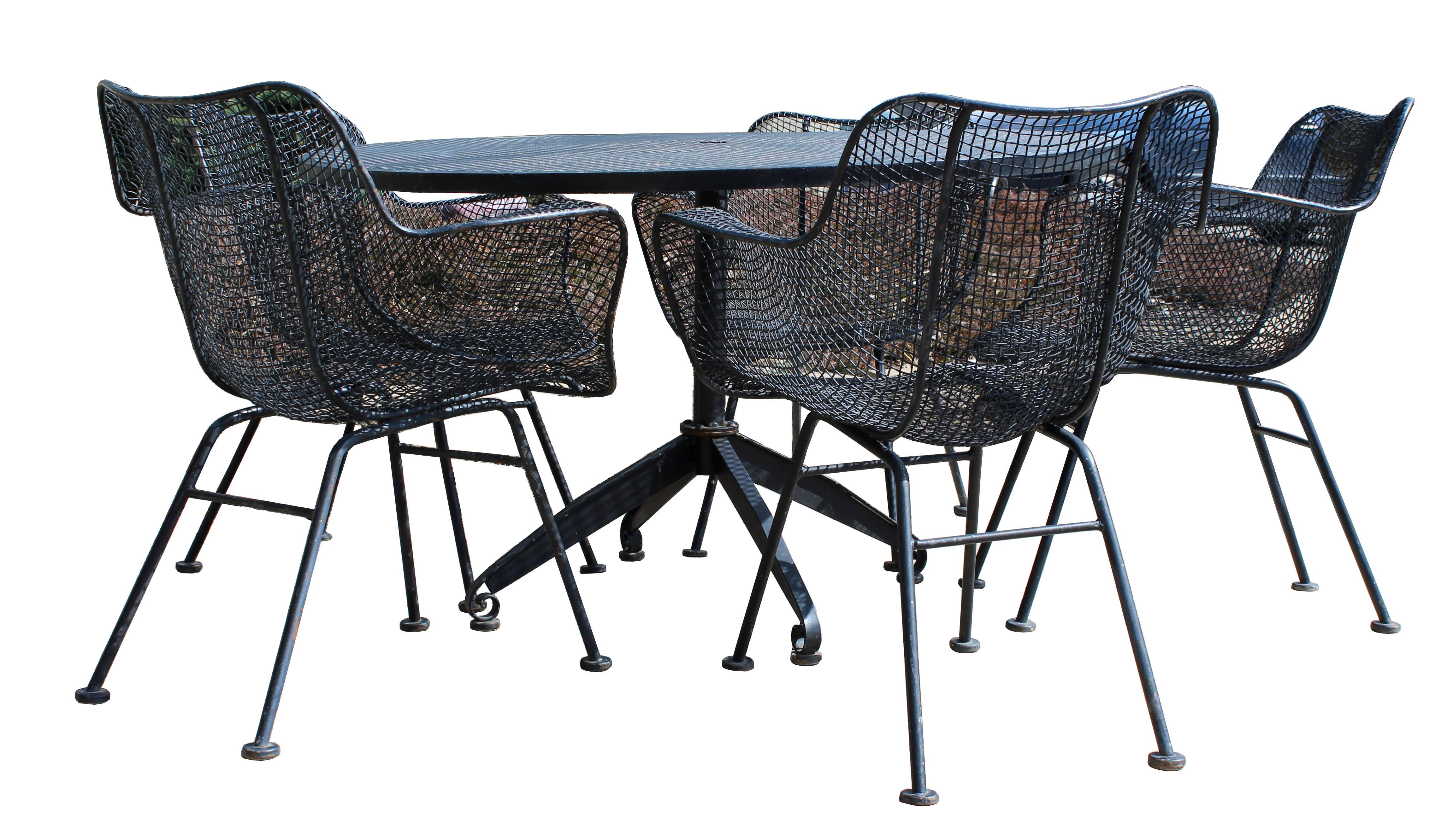 For your consideration is a gorgeous, Woodard patio set, including a table and five Sculptura armchairs. In great condition. The dimensions of the table are 48