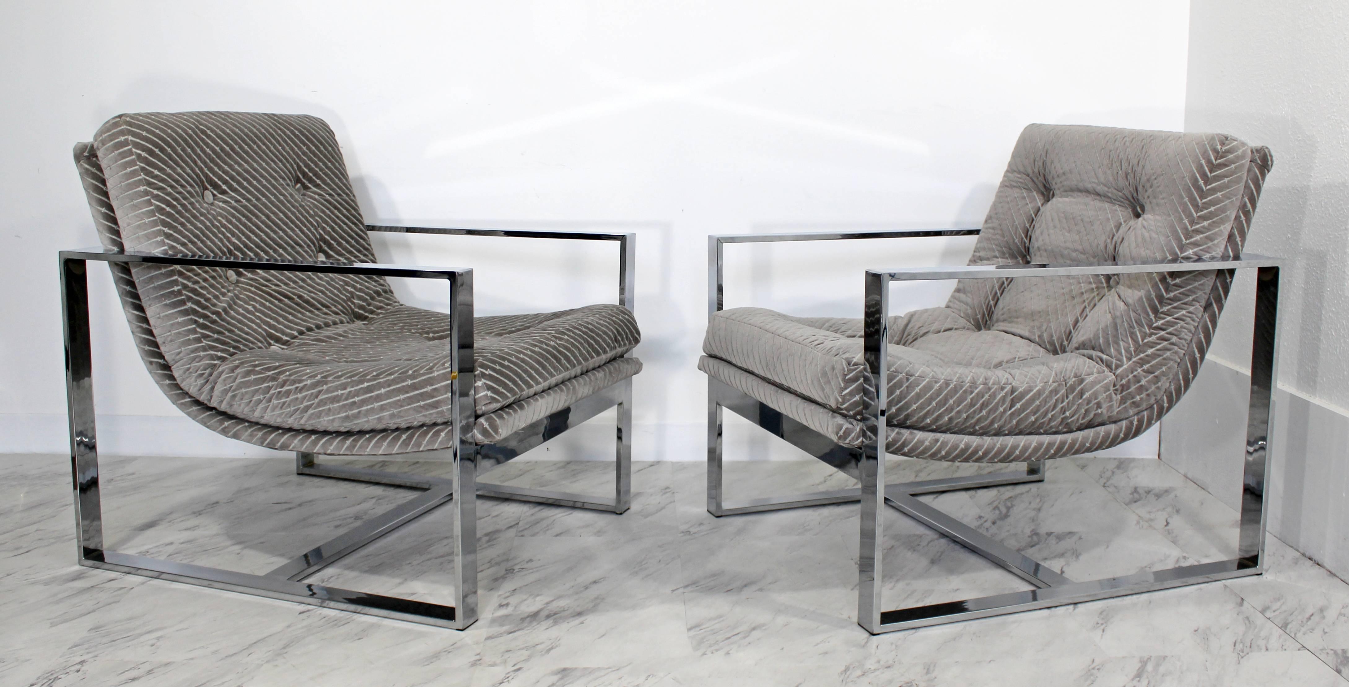 For your consideration is a fabulous pair of chrome flat bar scoop lounge chairs, designed by Milo Baughman. Freshly back from being reupholstered in an amazing mohair grey Kravets fabric. In excellent condition. The dimensions are 28