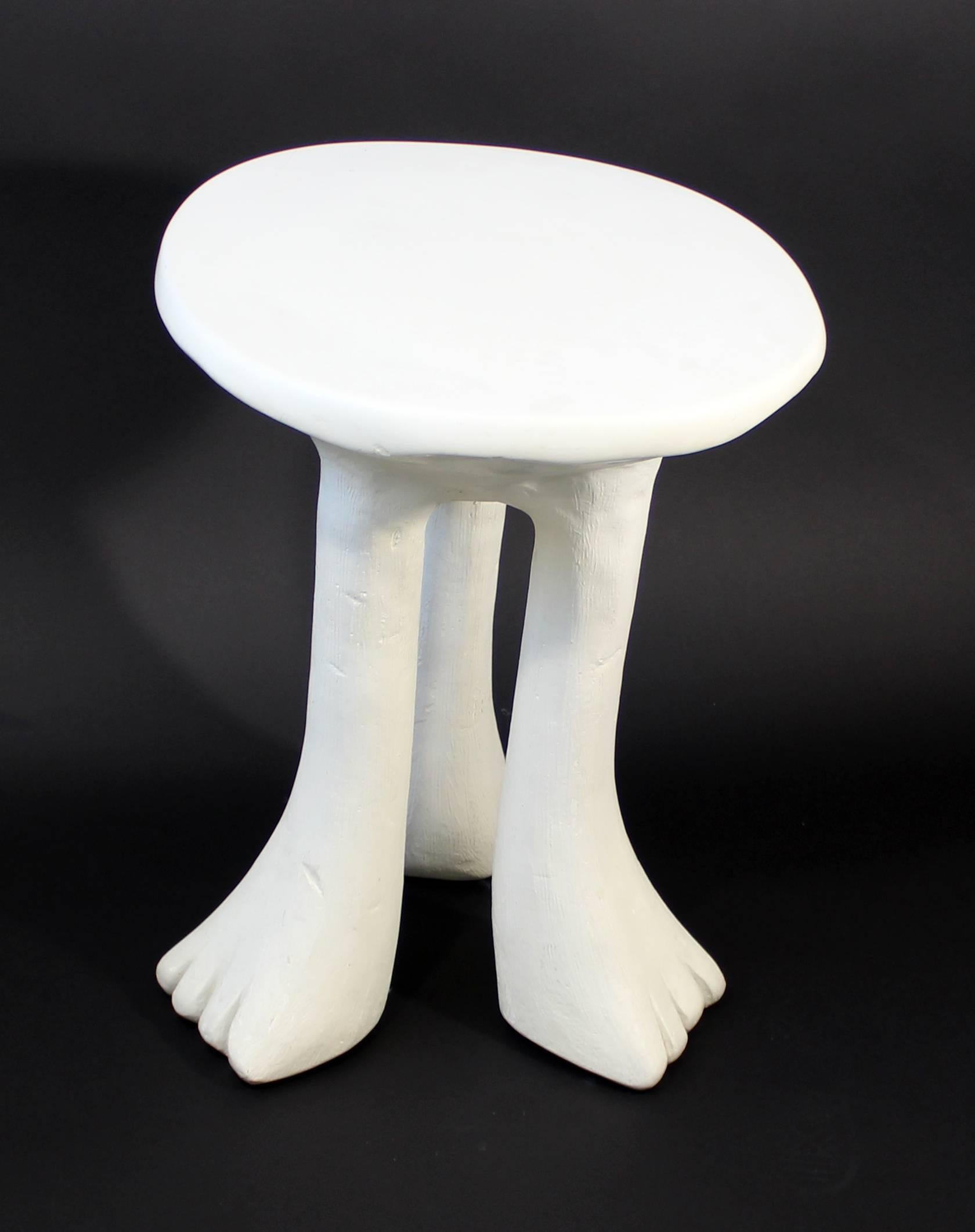 For your consideration is a fantastic piece by John Dickinson. The iconic "Africa" table, on three legs, in white plaster, circa the 1970s. In great condition. The dimensions are 16" diameter x 20" height.