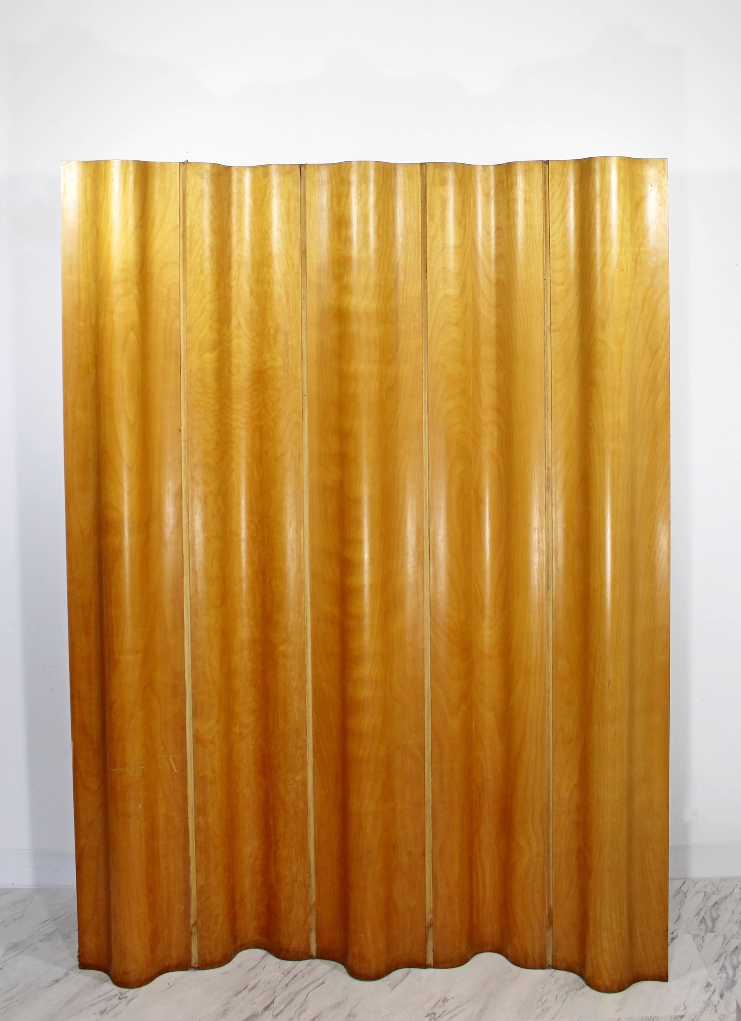 For your consideration is a gorgeous and rare, bentwood, folding screen, made of ash and held together by a woven canvas, designed by Ray & Charles Eames in 1946. This is a vintage Herman Miller production, not a contemporary reproduction. In very